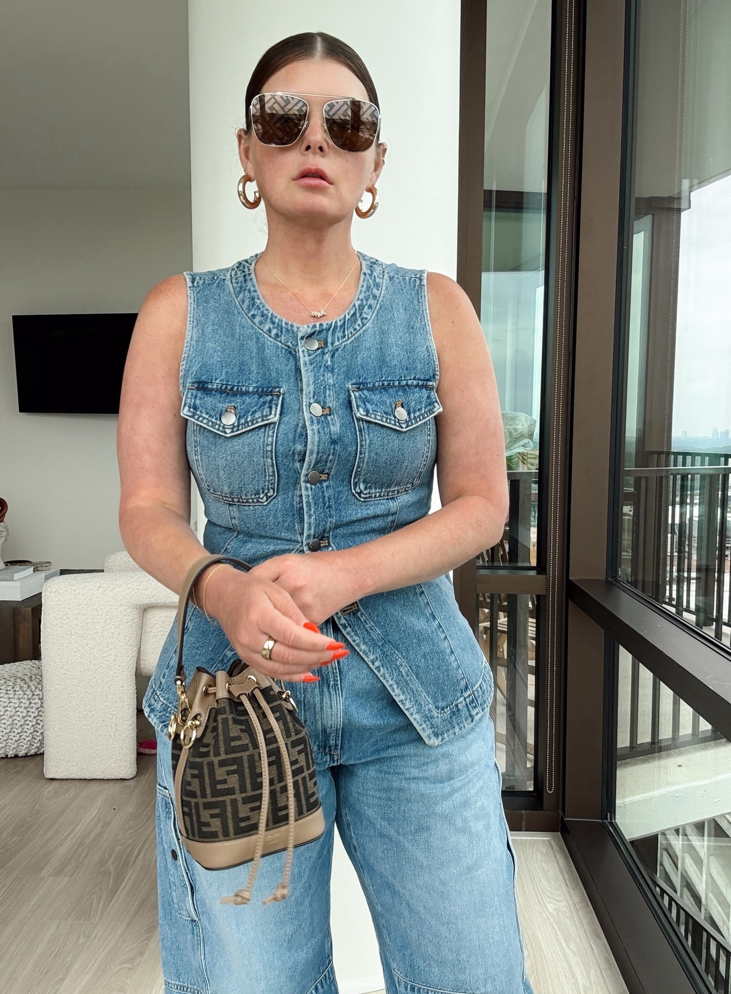 Denim vest fits true to size but is NOT bust friendly. 