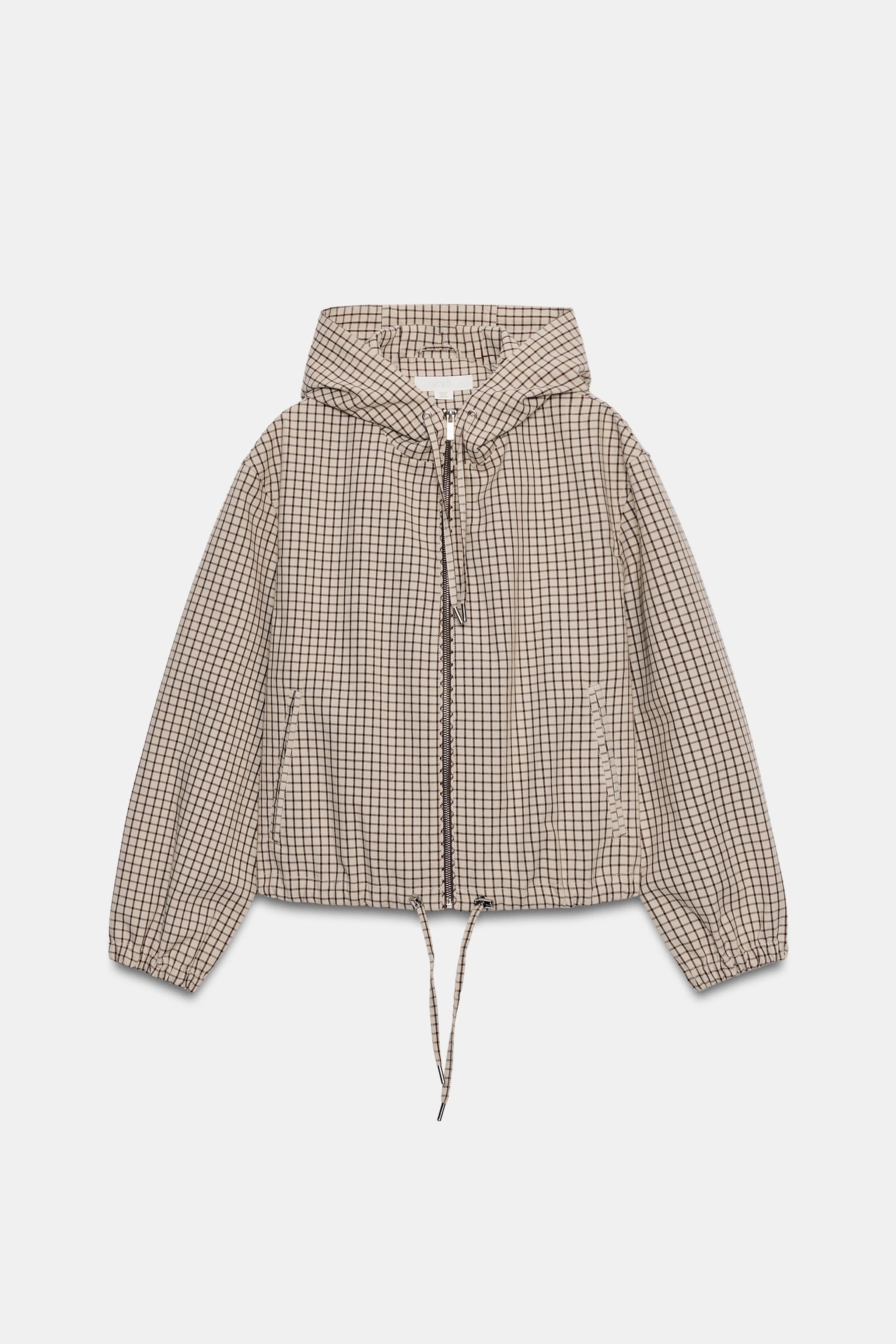 Jacket featuring an adjustable drawstring hood and long sleeves with elastic cuffs. Front double-... | Zara UK