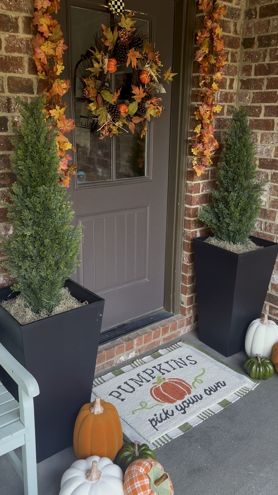 Front porch for fall (under $100)! I found a beautiful wreath, layered rugs and fall foliage to help me create a front porch for fall under $100. I then just added back in the plants, and other faux pumpkins I had on hand. So easy and turned out great. All the At Home items are the under $100! 

#LTKVideo #LTKHome #LTKSeasonal