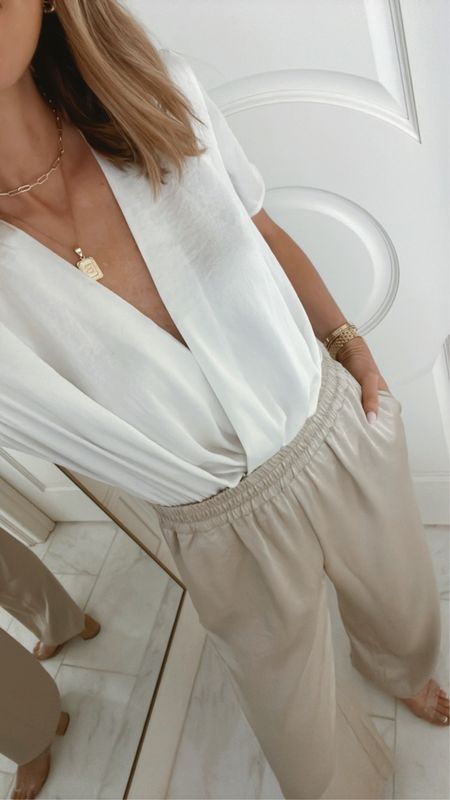 Spring workwear. Love this satin wrap blouse - it's a bodysuit so it fits well- I'm wearing size small. The satin wide leg pants fit tts wearing size small