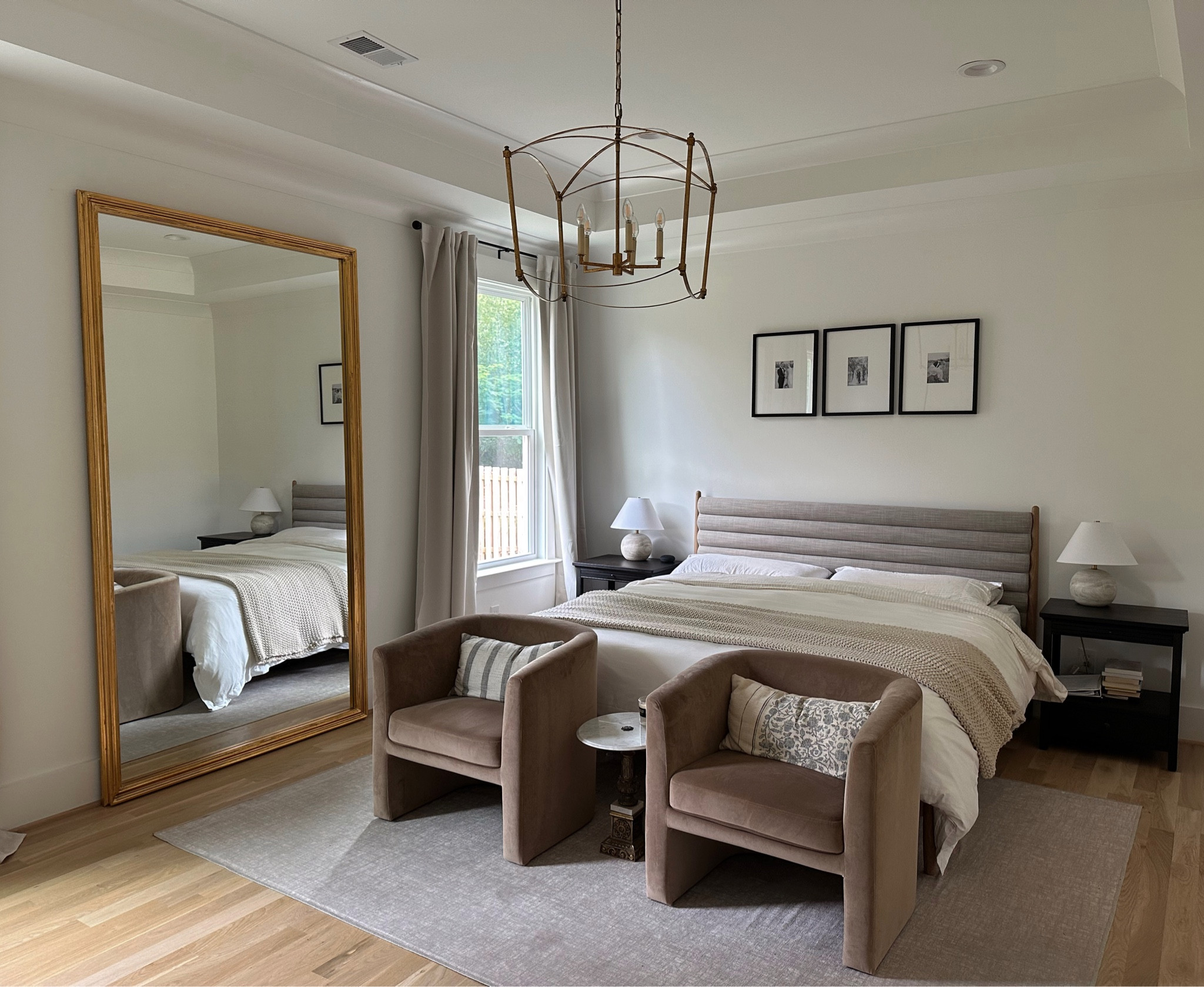 Bedroom inspo; bedroom decor; bedroom furniture; affordable chairs; studio McGee; modern transitional bedroom; ruggable ivory beige rug; lumens gold light fixture; bedroom chandelier 

#LTKhome