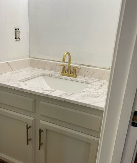 My new vanity counter and sink. It comes with the backsplash piece, side splash pieces sold separately. I have linked both. 

I followed the included instructions for installation. 

#LTKstyletip #LTKhome