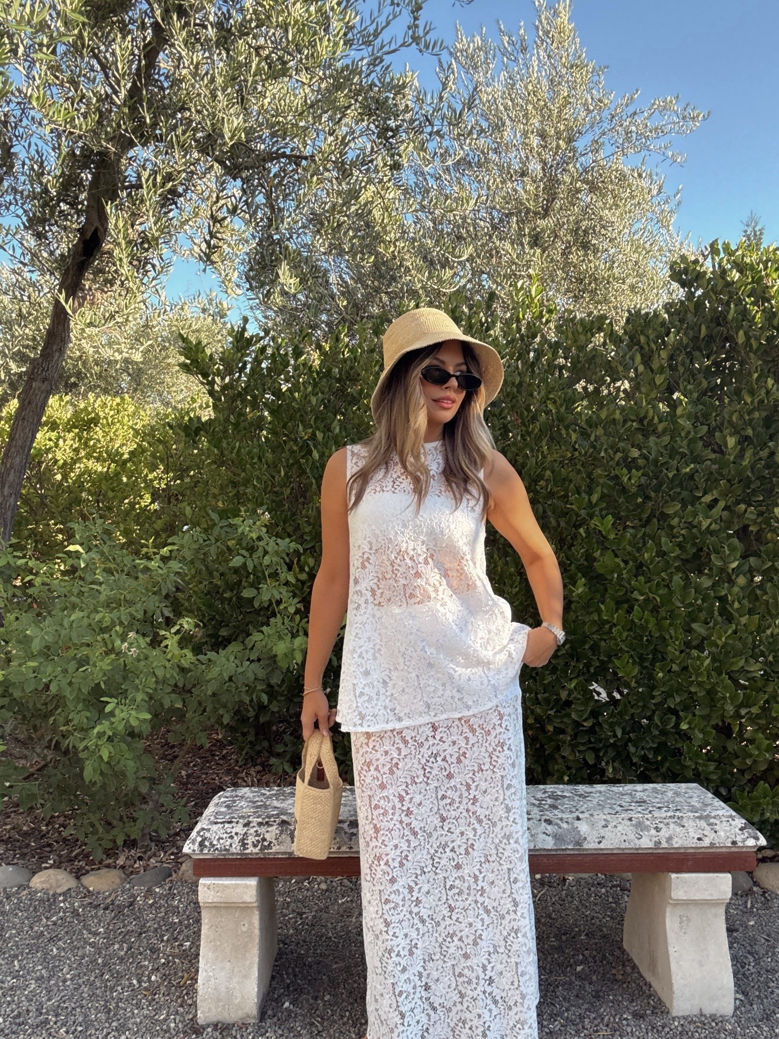 White lace set 🤍 Wearing a sleeveless lace top and matching lace maxi skirt with neutral accessories, a straw hat, woven bag, and black sunglasses. Perfect for vacation outfits, resort wear, summer brunch, bridal events, beach dinners, and European summer style.

#LTKootd #LTKdayinmylife