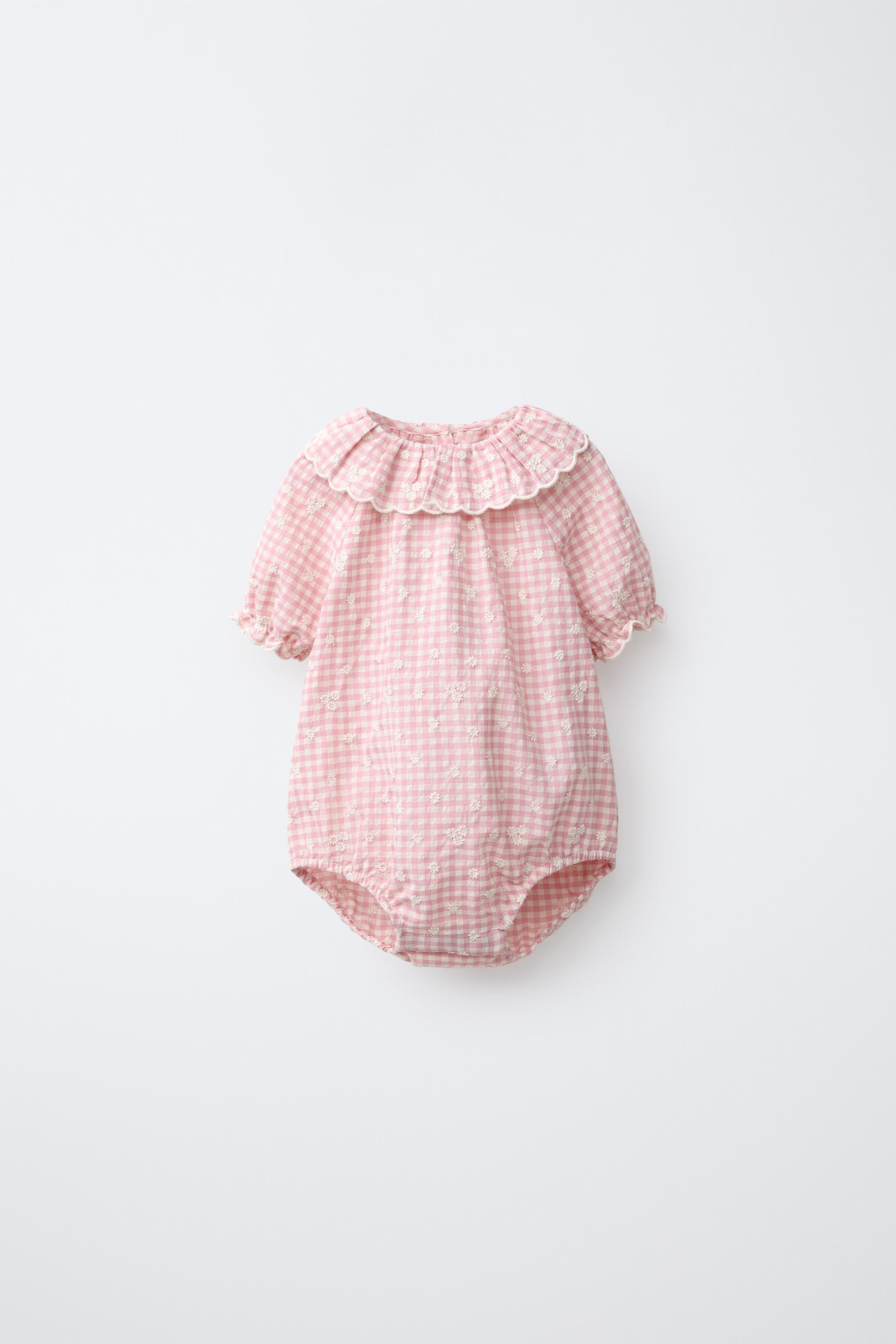Bodysuit with round neck and short sleeves with elasticized trim. Button closure at back and snap... | Zara US