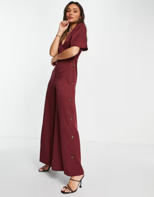 ASOS DESIGN button side batwing jumpsuit in berry | ASOS (Global)