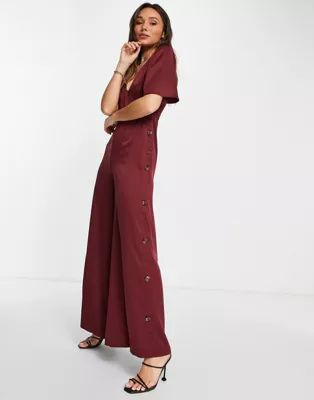 ASOS DESIGN button side batwing jumpsuit in berry | ASOS (Global)