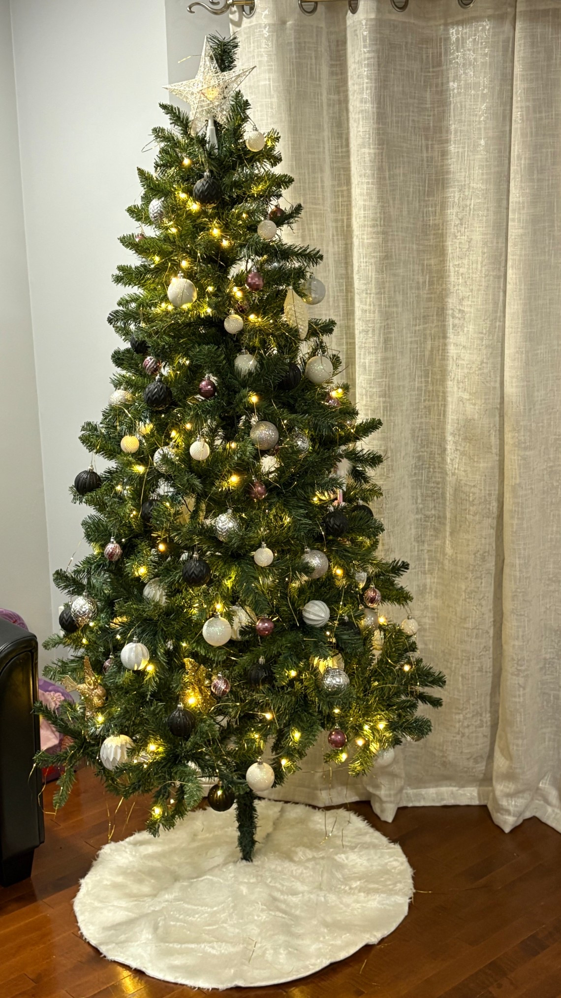 Started my tree 🎄 I have always kept it more neutral, with silver black and white. Last year I added pink for my daughter. 

#LTKhome #LTKholiday