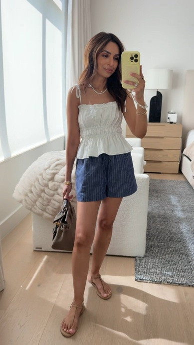 Our favorite pull on shorts in linen! These @aritzia shorts are 10/10 one of my favorite things to wear, so comfortable yet still put together. I'm in an XS in this cute ruched top that is a great mix and match piece! #aritziapartner

#LTKootd #LTKOver40 #LTKPetite