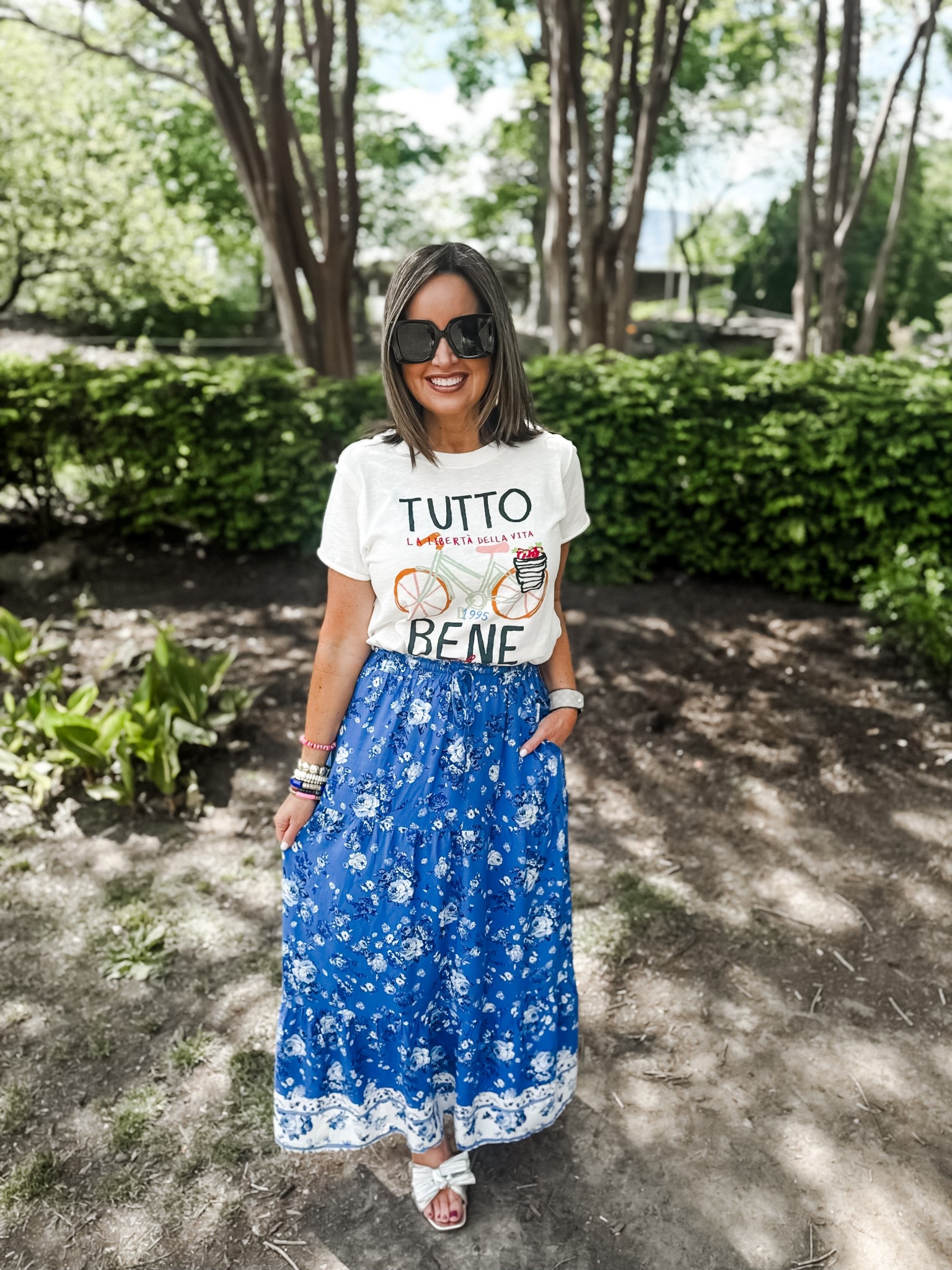 Anthropologie graphic tee - size down if in between 
Amazon skirt - true to size 
Sandals - use code LAURA15

#LTKSaleAlert #LTKFindsUnder50 #LTKFestival