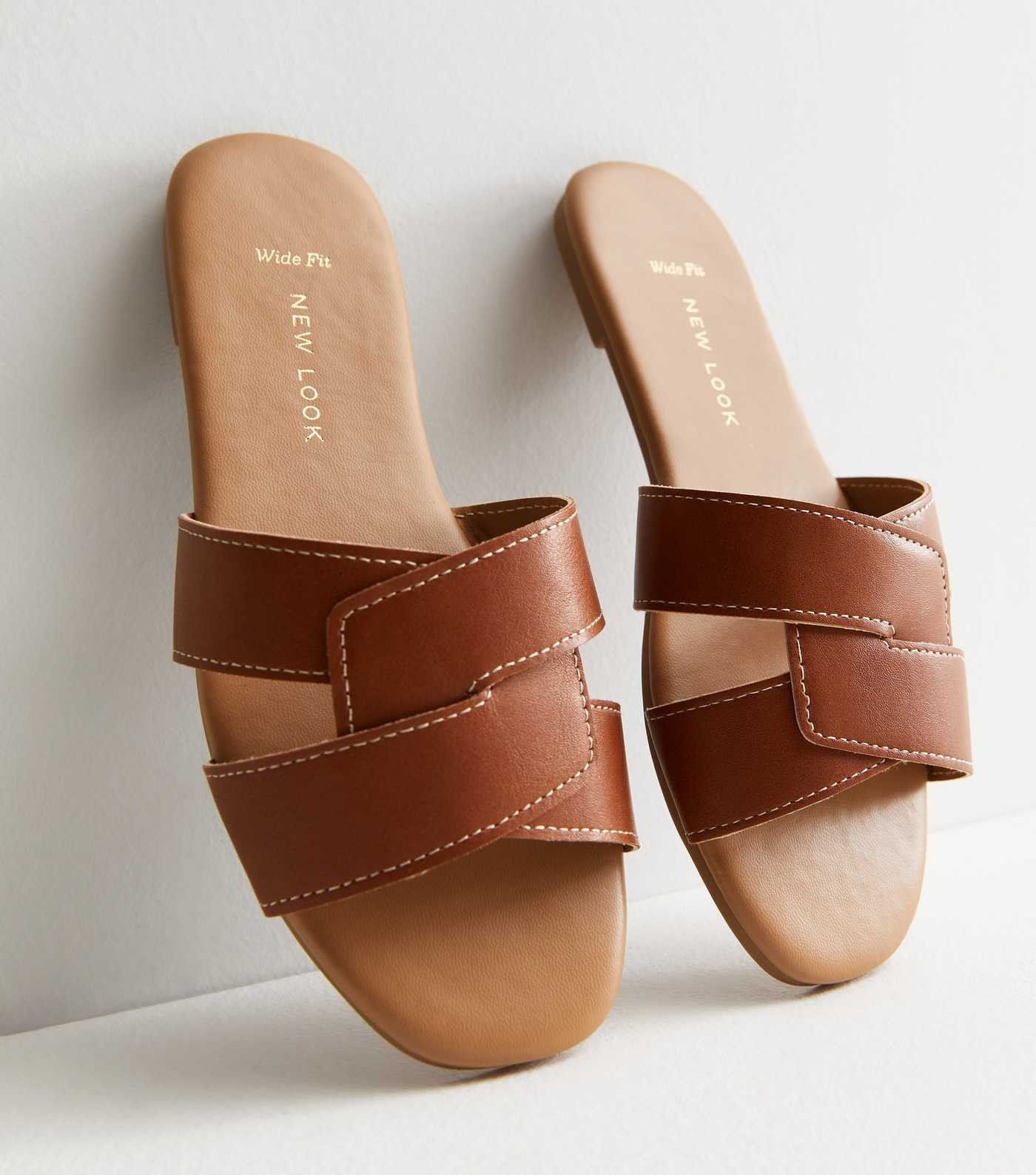 Wide Fit Tan Leather-Look Stitch Sliders
						
						Add to Saved Items
						Remove from Saved ... | New Look (UK)