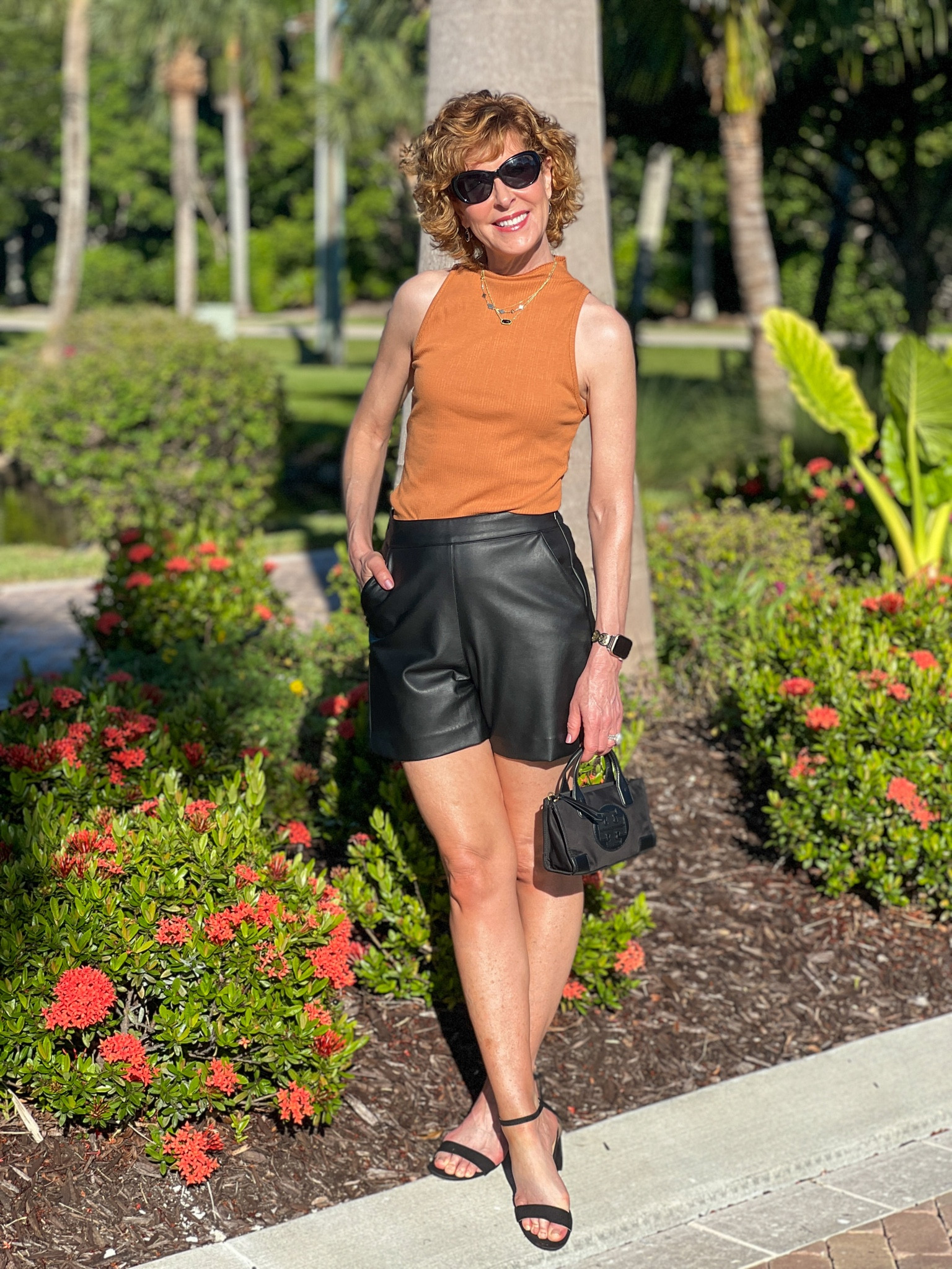 Fall outfit, faux leather shorts, micro bag, Fall top, mock turtleneck, caramel top, black block heel sandals, mini handbag, black handbag, designer handbag, designer purse, black purse, black Apple Watch band, black sunglasses, black necklace, black earrings, gold necklaces

This sleeveless mock tank top is the perfect fall layering piece! I love pairing it with pleated faux leather shorts and block heel sandals.

#LTKshoecrush #LTKunder100 #LTKSeasonal