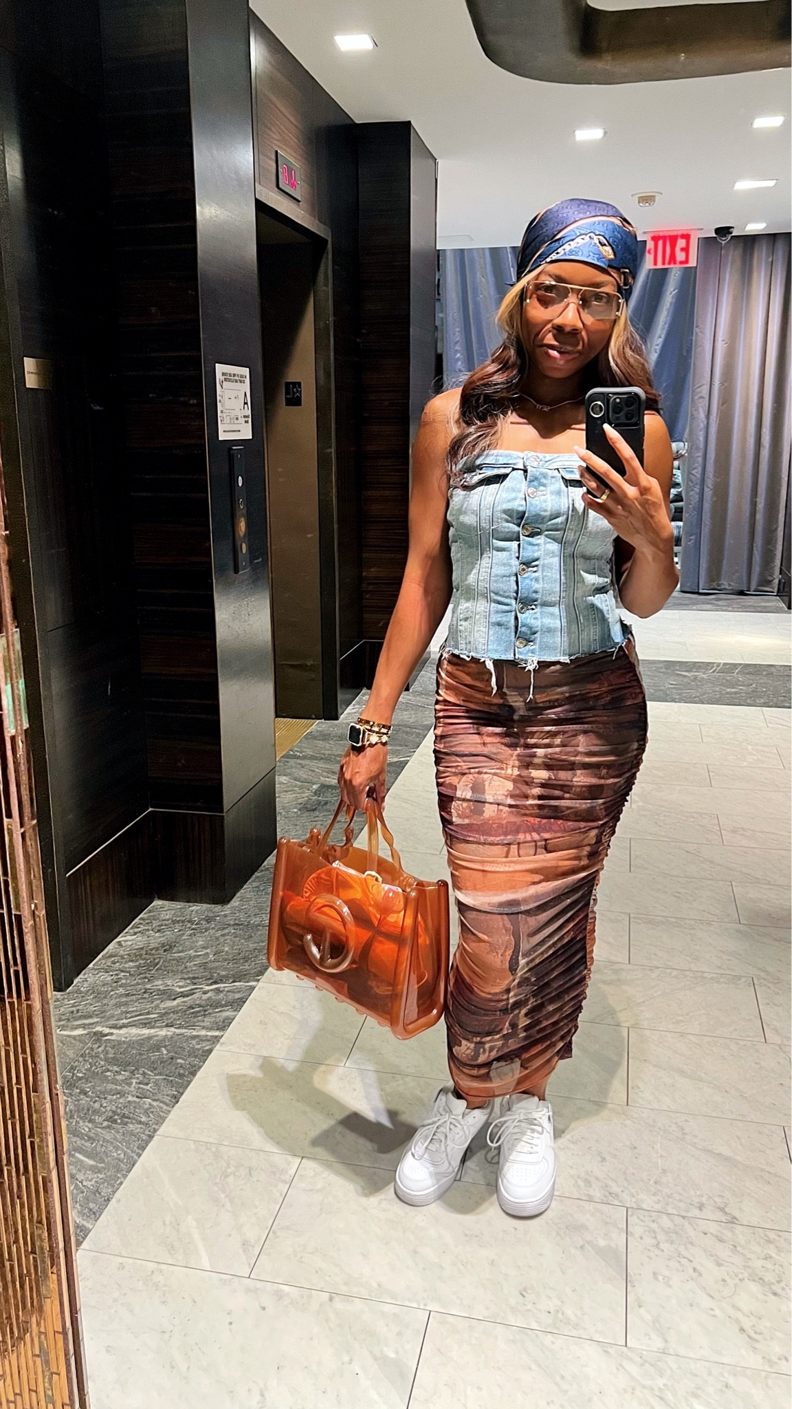 These $15 gold Amazon shades are great dupes for the Bottega Venetta Triangle Geometric Caravan in Shiny Gold Sunglasses 🙌🏾😩.

I wore this OOTD for a quick morning errands before a show. My strapless denim top is from ZARA (similar tagged) and this brown mesh maxi skirt was gifted to me by pretty little thing.

This is a great transitional or early fall outfit, and it would be a cute date outfit too. I wore my white Air Force ones as those are my go to sneakers with every outfit. 

#LTKSeasonal #LTKfindsunder50