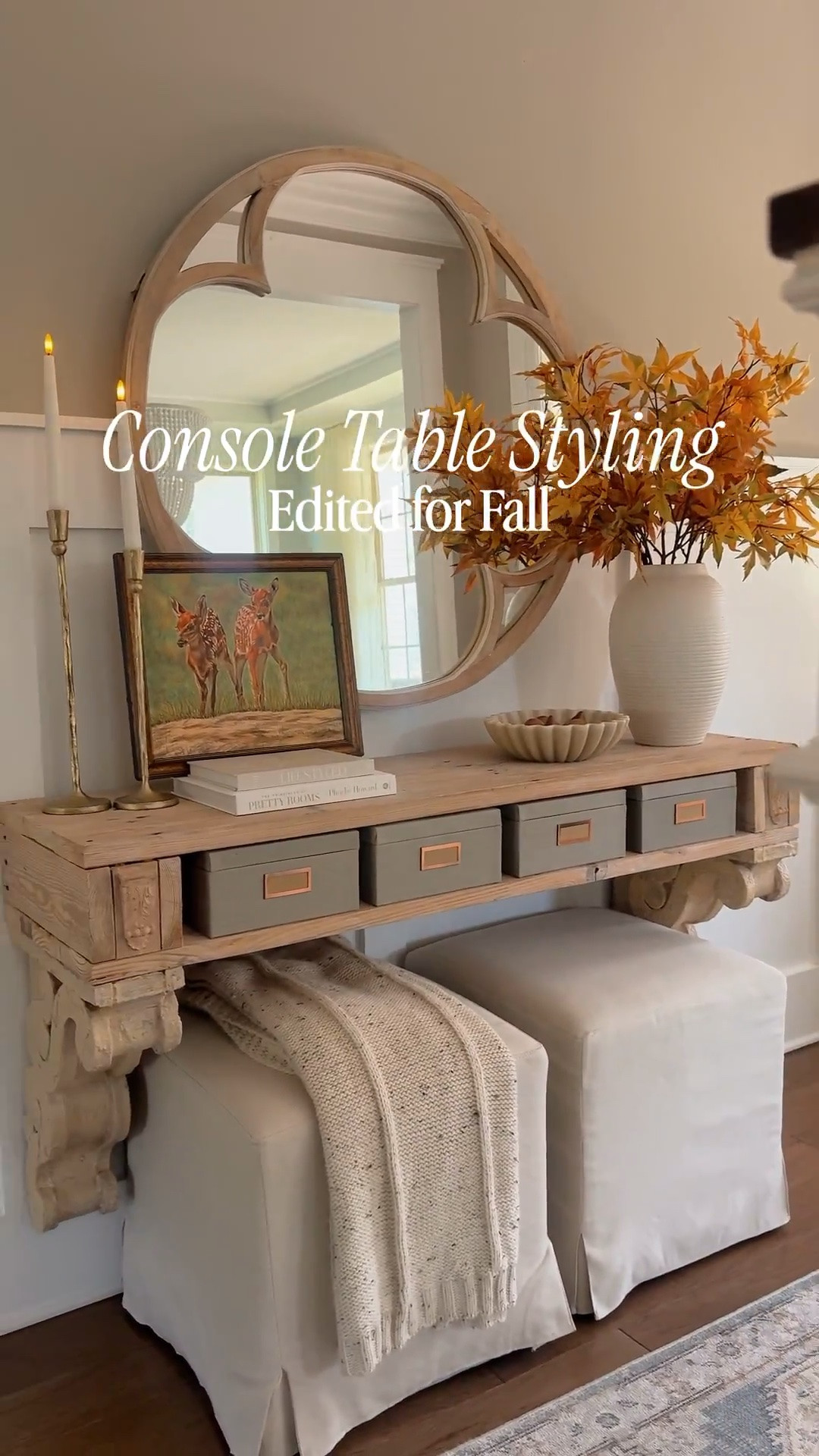 In break from tradition, I’m editing my fall console table this year. Maximizing simplicity over enthusiasm for all things fall. 
And I’ve enhanced my table some as well-painted the corbels, added wood covers with wood decals to the boxes and added some ottomans. I’m considering adding a piano hinged door to the opening to hide my boxes but that might be a later project. 
I also finally finished my deer artwork featured here on my table. If you love this look for fall, don’t worry, I found some similar for you. Happy Fall y’all!

#LTKHome