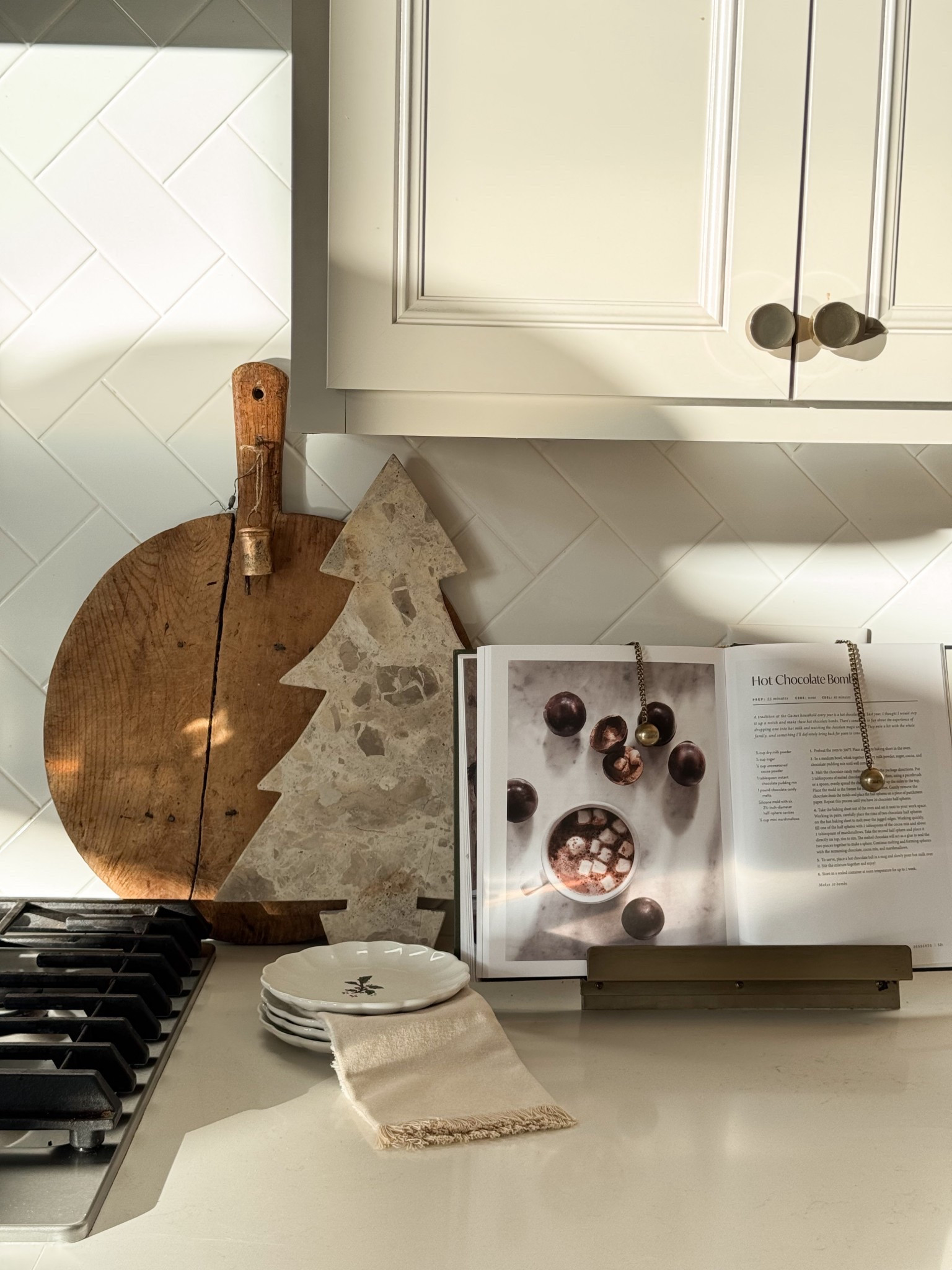 subtle christmas kitchen counter styling✨🦌

keep it simple and added my new marble tree board. the soft neutral tones make it feel festive in the prettiest, most understated way

#LTKHome #LTKFindsUnder50 #LTKHoliday