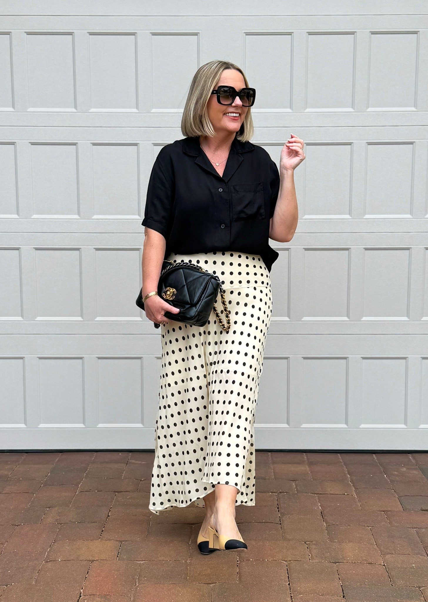 Polka dot skirt and a satin/silk shirt. Beige and black. 


#LTKOver40 #LTKootd