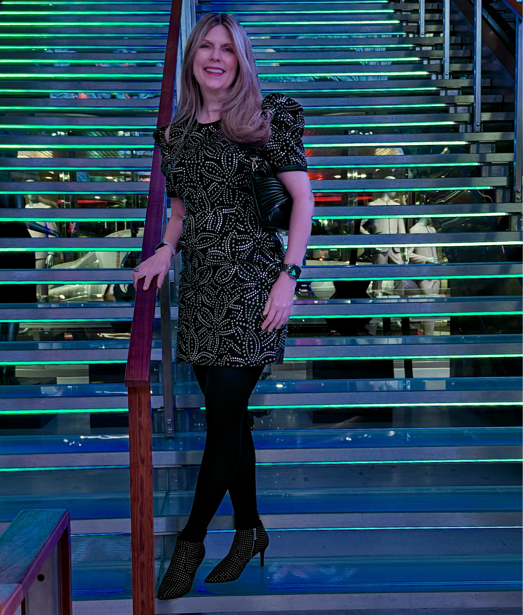 #Embellished #LBD on #NYE. #cutout sleeves, paired with #studded boots and #clutch bag  

#LTKParties #LTKStyleTip #LTKSeasonal