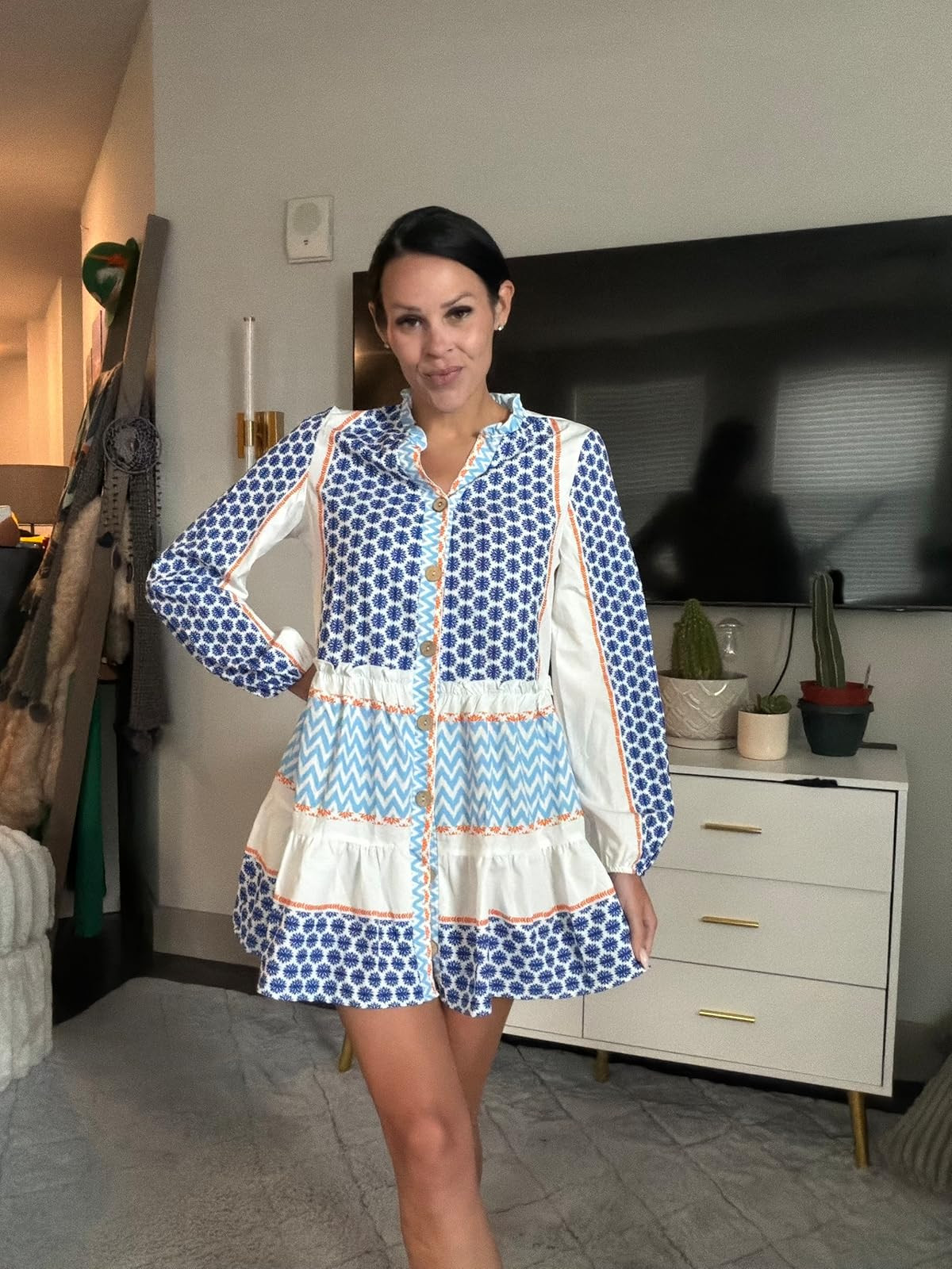 How darling is this blue and white printed mini dress? The tiered ruffles, button-down front, and bright orange accents make it the ultimate choice for a sunny brunch or beach day! Share with a friend and click the link in my bio to shop the look! #LTKunder100 #SummerDress #CoastalStyle 

 #LTKdayinmylife #LTKgrwm #LTKootd