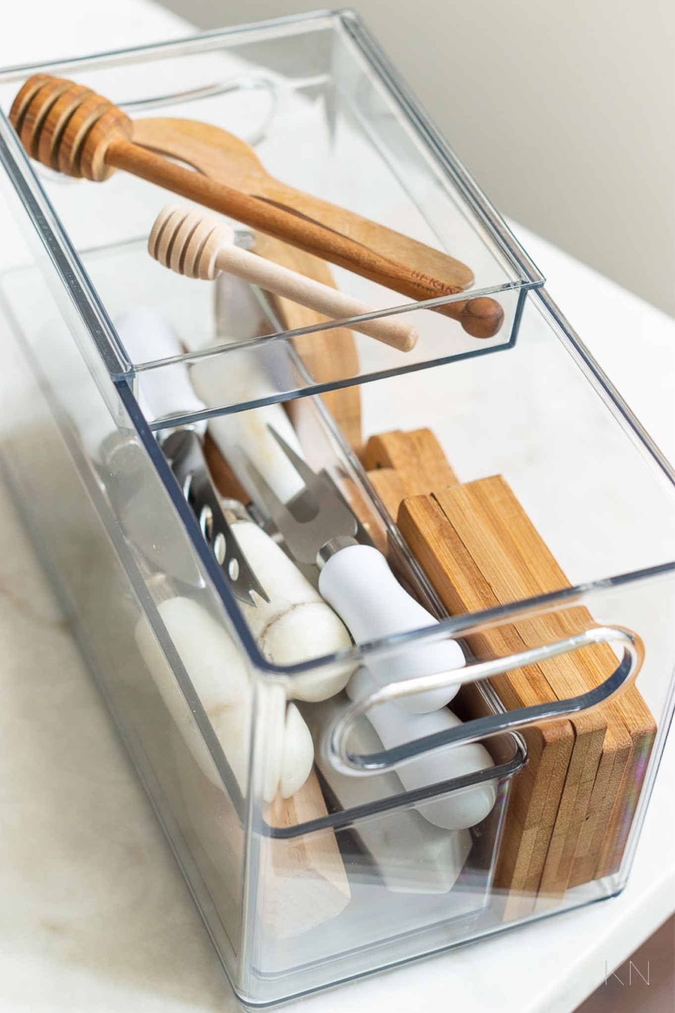 This narrow bin with a slider tray is perfect to store several of my entertaining items that I seldomly use. It’s the perfect size to tuck away in a kitchen cabinet and contains lots of different items. home storage kitchen storage kitchen cabinet organization kitchen organization home edit find#LTKStyleTip 

#LTKHome #LTKFindsUnder50