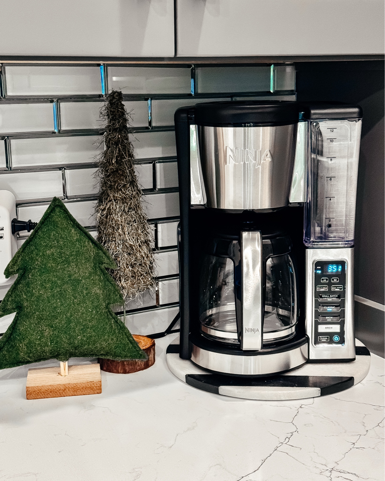 🚨On Sale Under $70
Nothing beats the smell of a fresh pot of coffee brewing at home. Our old coffee maker finally gave out, so I grabbed the Ninja Fresh Brew 12-Cup Programmable Coffee Maker and I’m already obsessed. It makes a perfect, smooth pot of coffee every single time—no bitterness, no fuss.

I love that it brews small or large batches just as well, so whether it’s a slow morning at home or a full house, it keeps up. The programmable delay brew means waking up to hot, fresh coffee (a non-negotiable over here), and the adjustable warming plate keeps it hot without tasting burnt. It’s sleek, easy to use, and fits right into a cozy, everyday kitchen.

If you’re a “just give me a good cup of coffee” kind of household like us, this one is such a win—and it makes an amazing Christmas gift for coffee lovers, couples, parents, or anyone upgrading their kitchen this season. 

Ninja coffee maker • 14 cup coffee maker
programmable coffee maker • drip coffee maker • best coffee maker for home • coffee maker Christmas gift • coffee maker for families • large capacity coffee maker • automatic coffee maker • kitchen gift ideas • fresh brew • coffee lovers • morning routine • holiday gifting • Christmas gift idea • home essentials • everyday coffee 

#LTKGiftGuide #LTKHome #LTKmorningroutine