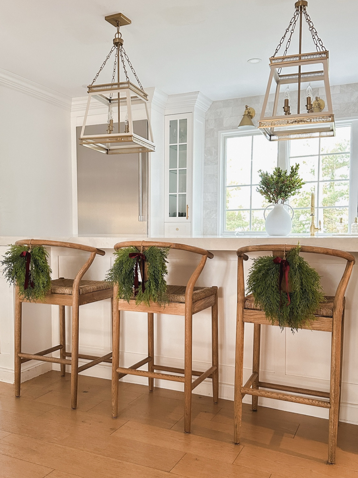 A touch of Christmas can be found in my kitchen by hanging mini wreaths on my wood counter stools. 

#LTKSaleAlert #LTKHoliday #LTKSeasonal