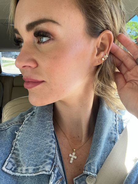Nikki smith design 
Cross necklace 
Bow earrings 