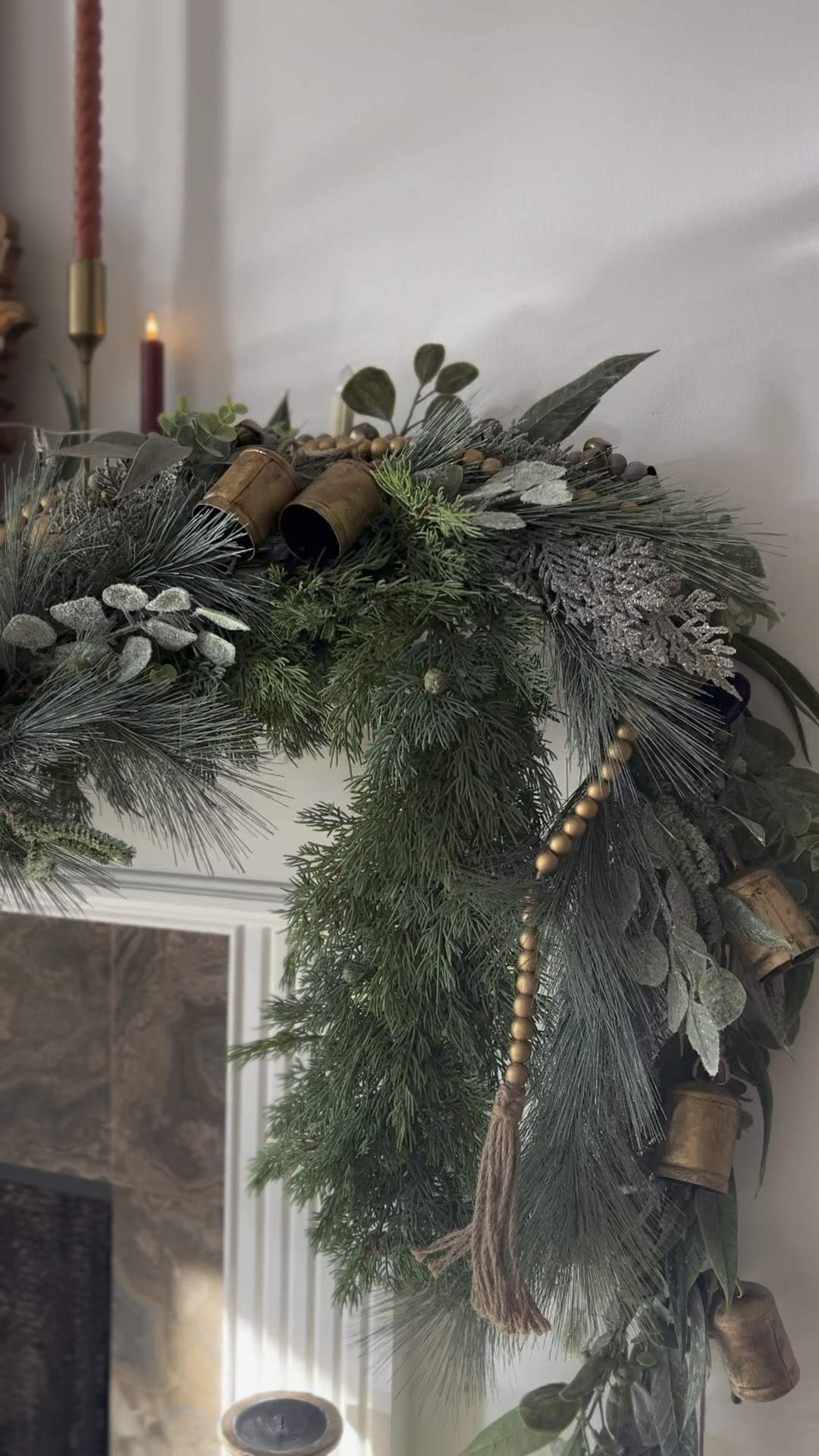 Mantel Christmas, Christmas mantel with gold bead garland, faux green garland, faux wax candles 

#LTKHoliday #LTKsalealert #LTKhome