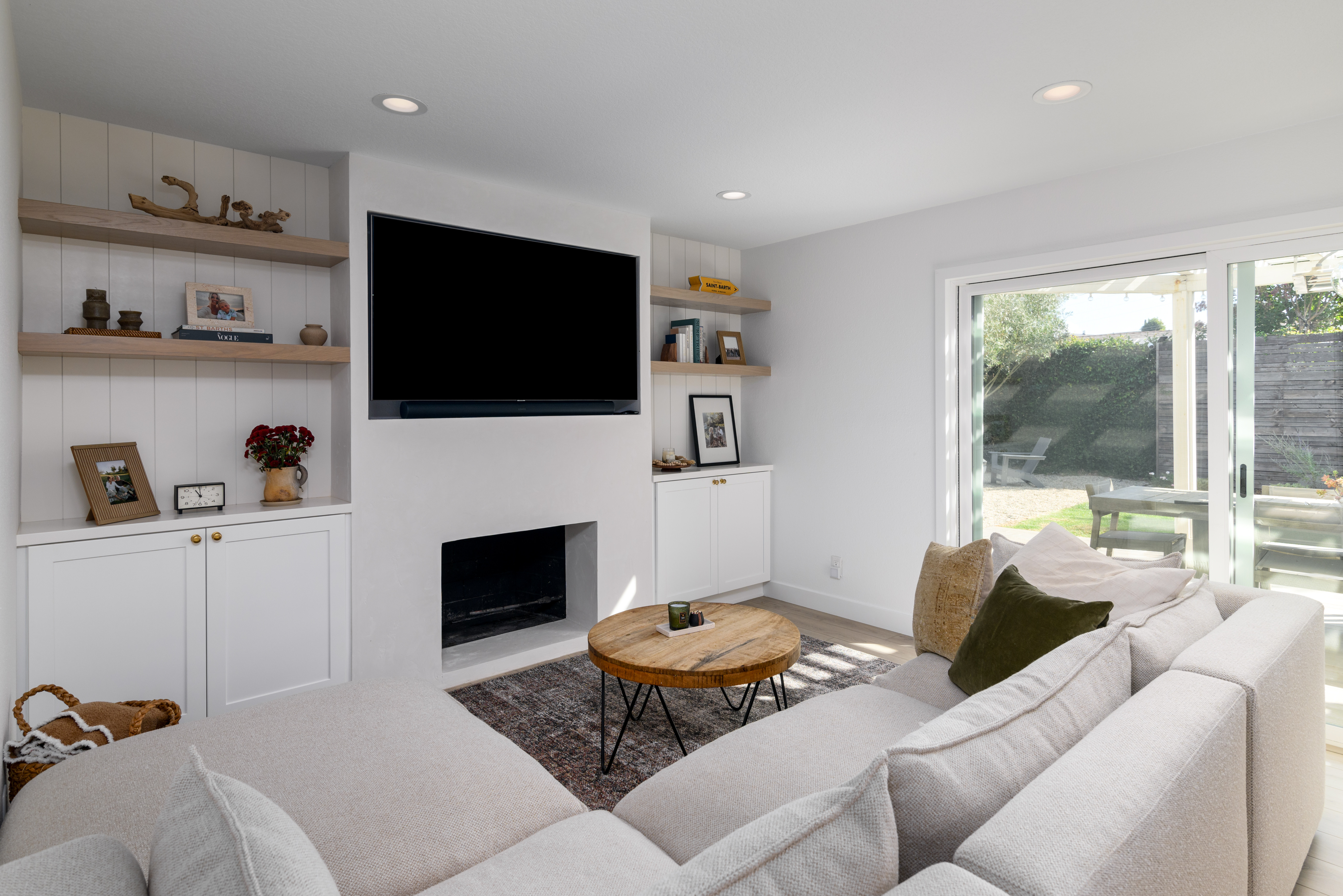 A fireplace that blends warmth and sophistication! White shaker built-ins with brass hardware provide stylish storage, while white oak floating shelves create the perfect display space. Framed by a plaster fireplace and grounded by white oak LVT flooring, this space feels both timeless and inviting. Who else loves this cozy-chic look? 

Tap to shop our favorite design elements!  

#FireplaceGoals #FireplaceRemodel #HomeInspo #CustomBuiltIns #ShakerCabinetry #BrassHardware #WhiteOakShelves #PlasterFireplace #InteriorDesign #StorageSolutions #TimelessDesign #CozyModern #WhiteOakFloors #DesignBuild #DreamHome #LTKHome 

 #LTKHome