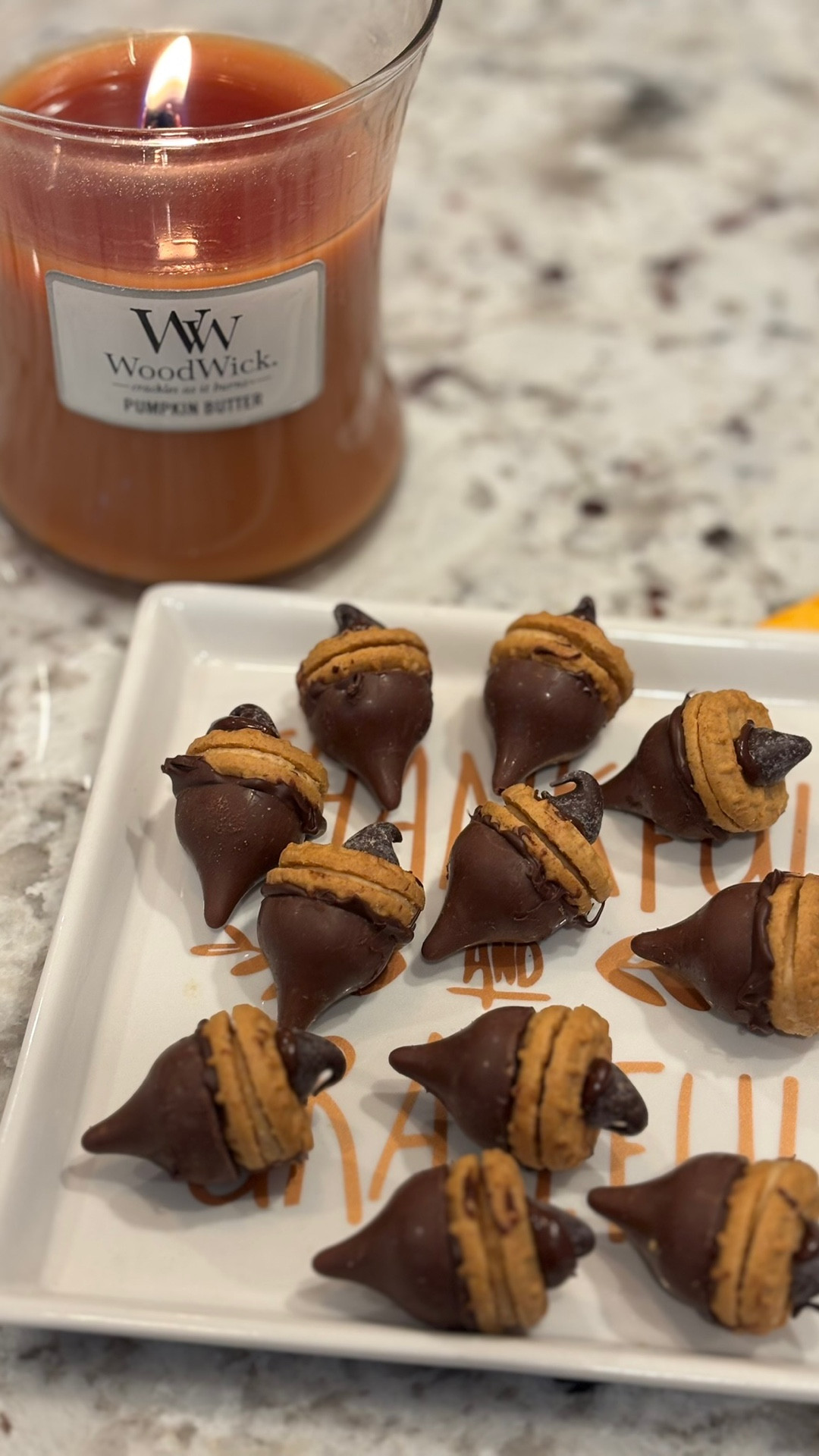 Let’s make a quick and easy Fall themed treat! Perfect for any Fall gathering, these little acorn inspired bites are a hit! Ingredients needed: 
•Mini Nutter Butter Cookies 
•Chocolate Chips 
•Hershey Kisses 
First melt some chocolate chips and dip the top part of the Nutter Butter cookie into it, add on the Hershey kiss, then dip a chocolate chip in the melted chocolate chips and stick it on the other side of the cookie to make a cute little acorn! These are so adorable and the perfect amount of sweetness. 🐿️🧡
•
•
•
#fall #fallvibes #fallfoodie #fallfood #diy #acorn #acorncookies #acorns #falltreat #autumn #inthekitchen #falldiy #fallismyfavorite #foodreels #foodieofnc #ncfoodfinds #foodpost #creativity #getcreative #thanksgiving #mealprep #snacks #nutterbutter #chocolatechips #hersheykisses #easytreats #simplerecipes 

#LTKHalloween #LTKSeasonal #LTKFamily