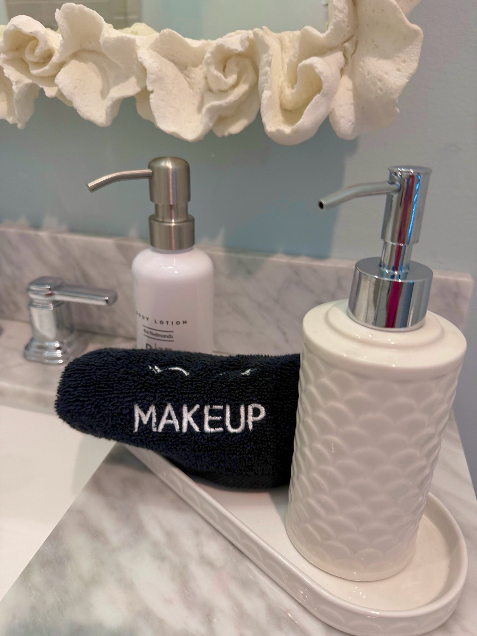 A beautiful way to accessorize your bathroom for guests or your own! The vanity tray and soap pump are beautiful ceramic with scallop detailing - affordable luxury

#LTKHome