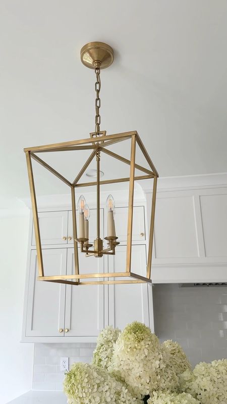 Our kitchen pendants are the medium size Darlana lanterns in antique burnished brass. They are a beautiful true brass color. We have two over our island that measures 7 1/2 feet long by 4 1/2 feet deep. I love the classic look at these. Kitchen pendant, brass lantern, visual comfort.

#LTKFind #LTKhome #LTKstyletip