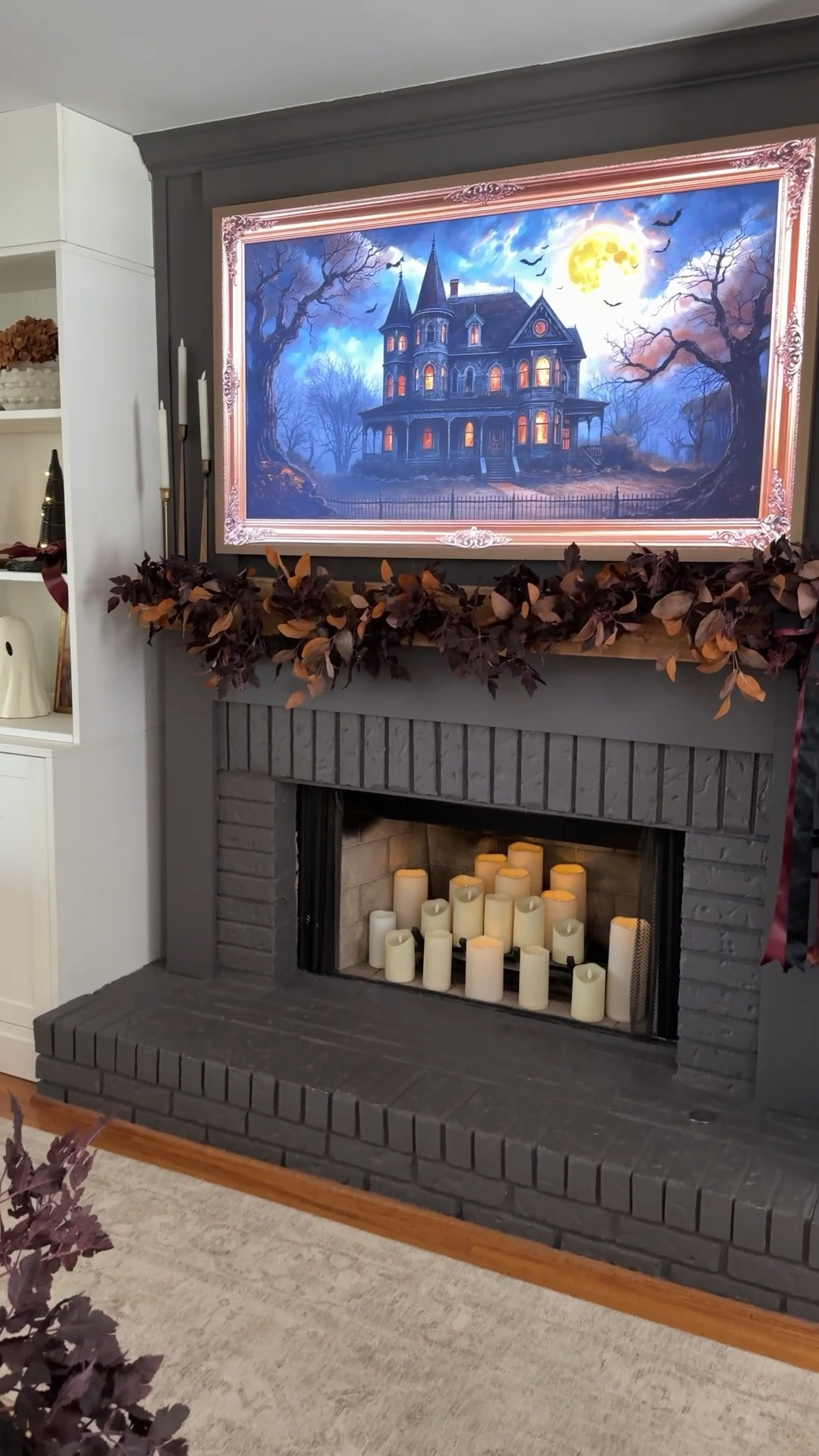 My Halloween mantle 

I used one 9 ft plum leaf garland 
And 7 fall stems to add extra dimension 

I secured mine with nails, but if you have a smooth mantle command hooks or straps would be a great option 

TV art if from YouTube (search “ tv art vintage Halloween” - lots of options to choose from 

#LTKHalloween #LTKHome #LTKSeasonal