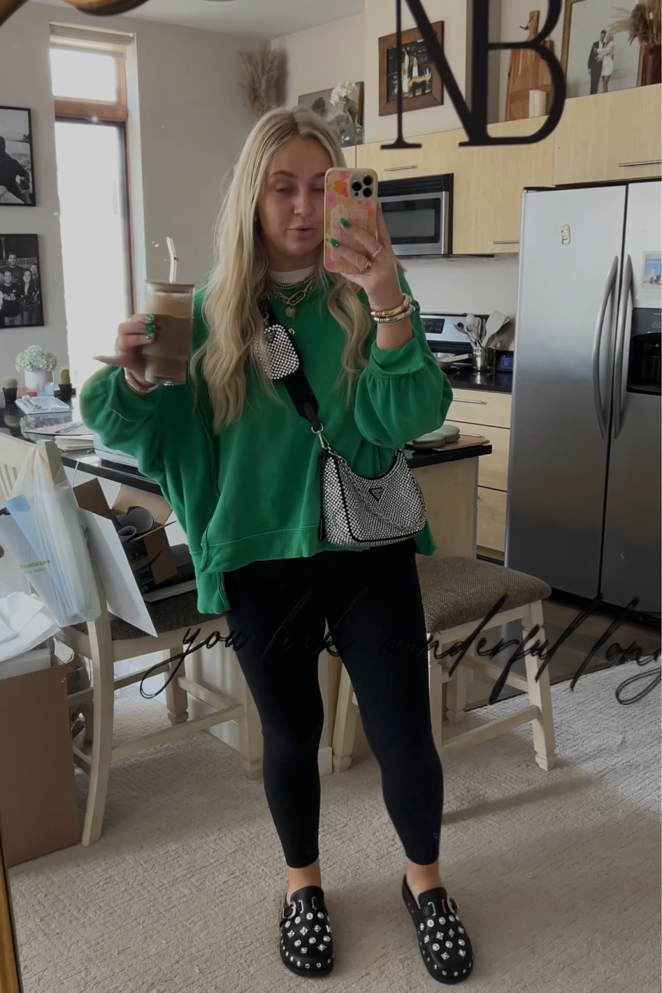 Medium in the black leggings from Amazon and the oversize sweatshirt from Free People