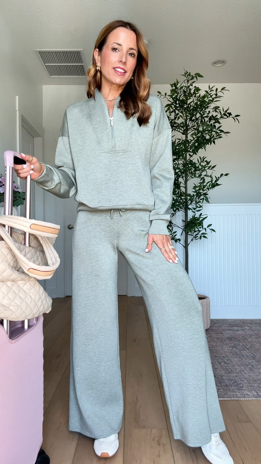 Code LTKSPANX. My all time favorite travel sets! Spanx AirEssentials matching set in XS petite pants and XS top. Airport outfit. Travel outfit. Tory Burch sneakers - I sized up half a size! My favorite travel tote with a million pockets! Beis luggage with cover. 

#LTKootd #LTKTravel #LTKSpringSale