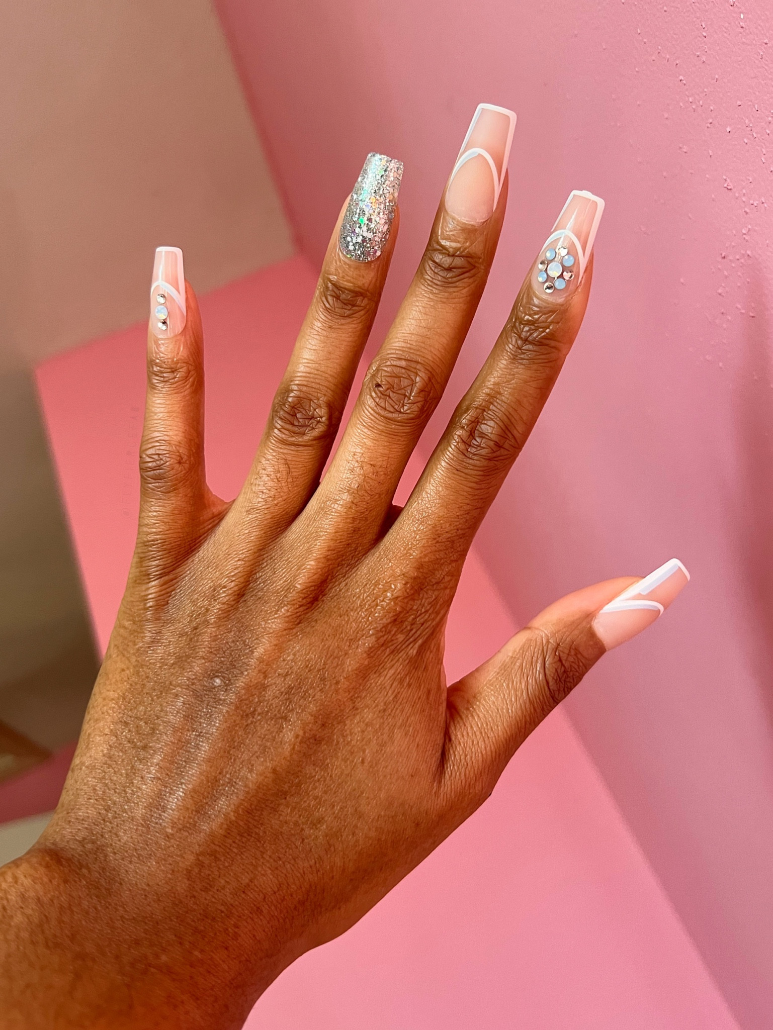 You can’t tell me that my $12 press ons from KISS don’t look like acrylics 🙌🏾😩. 

I love the white & blue strips on these clear nails with the rhinestones. They feel super fabulous for the winter ❄️💎✨.

I used my trusty Static Nails glue to apply them, and let it dry overnight for maximum hold.

#LTKSeasonal #LTKbeauty #LTKFind