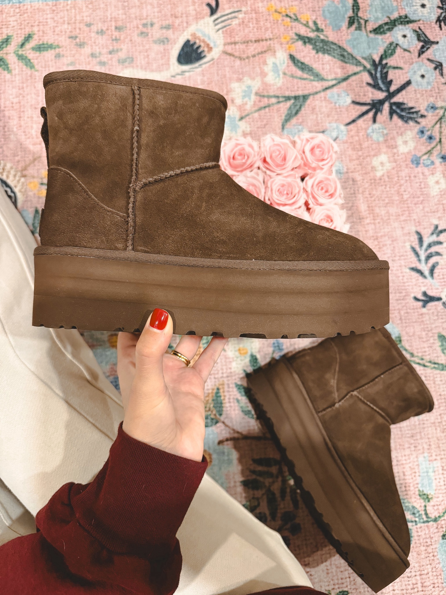 Ugg mini platform boot - I am a 7.5 and get a 7. See my mini review below!

I ordered these boots because my Ultra Minis are looking pretty rough these days and these surpassed my expectations in person! They are SO cute in person, not too clunky and the color is incredible. My Ultra Minis got dirty around the toe from stepping in wet grass and puddles several times, so I think the platform on these will help them from being destroyed by the elements. The dark color also works in my favor to mask dirt! I have some Lululemon flares that are a hair too long, and these will be perfect with those! The mini shaft is also easier to get on than the Ultra Minis. If you’ve tried getting the Ultra Minis on, you know how difficult that can be! I wear a 7.5 and size down to a 7 in most Ugg boots.

#LTKshoecrush #LTKHoliday #LTKGiftGuide