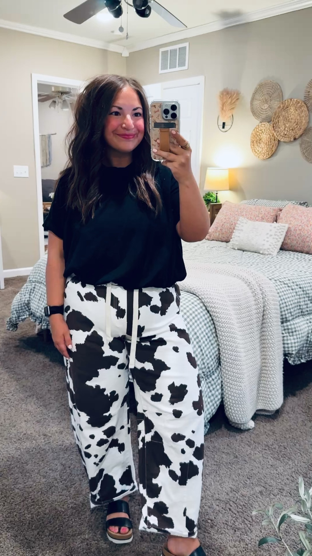 Stepping a little out of my comfort zone and I’m not mad about it 🤠 These cow print pants are such a fun statement piece! Paired with a simple tee or sweater to let them shine—comfy, bold, and guaranteed to turn heads 🖤✨

sandals: fit true to size // wearing a 5
jeans: fit true to size // wearing a large
bubble tee: fits true to size // wearing a large 

 #LTKootd #LTKMidsize #LTKWorkwear