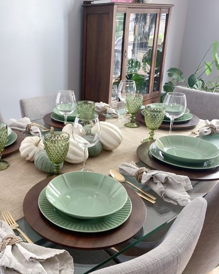Green tablescape for a fall dinner party. Add the jute table runner, wooden chargers and white and green pumpkins for a rustic chic touch. 
I used real pumpkins, but you’ll find some  faux options in the same colour scheme 

#LTKstyletip #LTKhome #LTKSeasonal