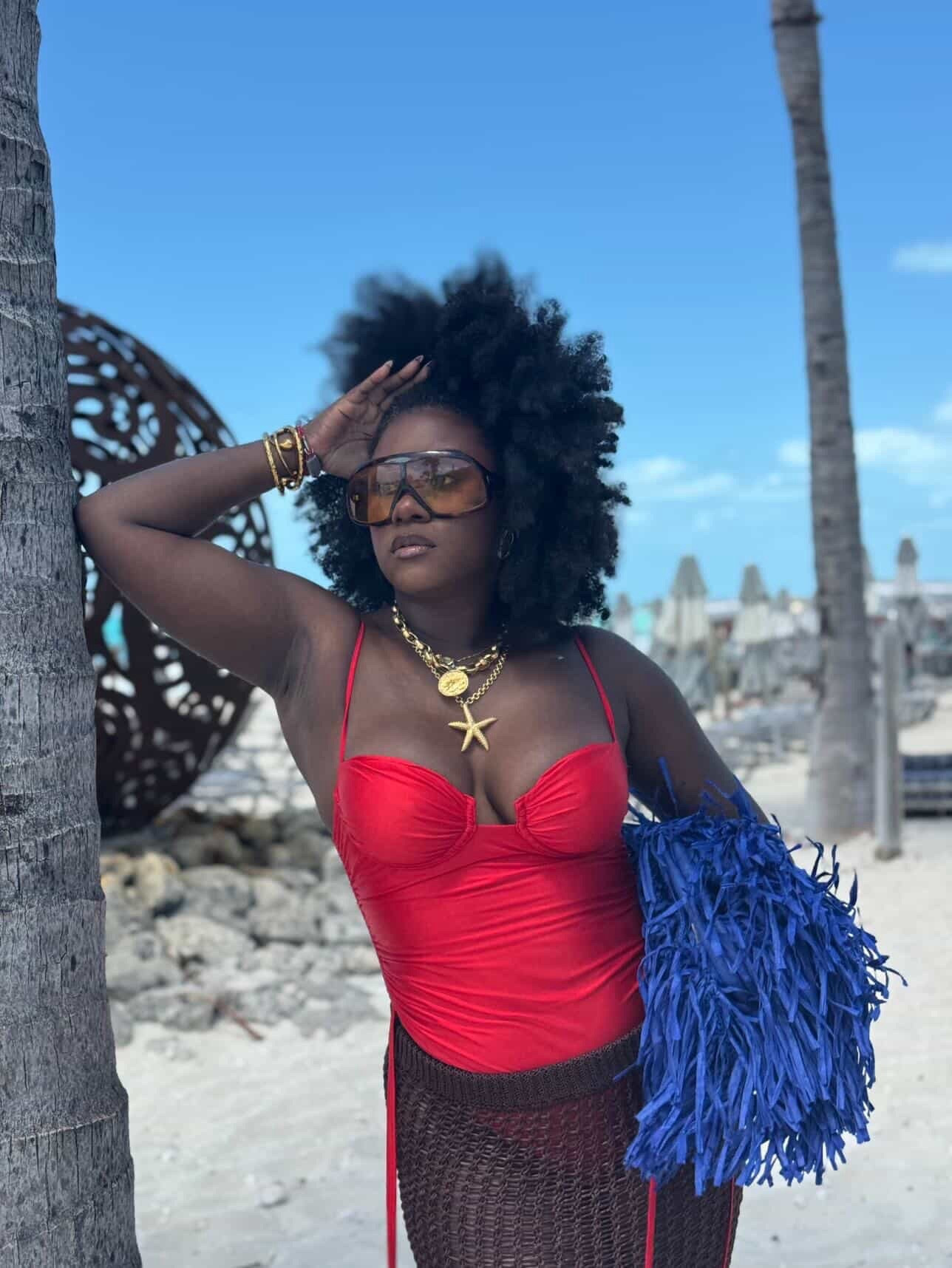 Red swimsuit with raffia bag