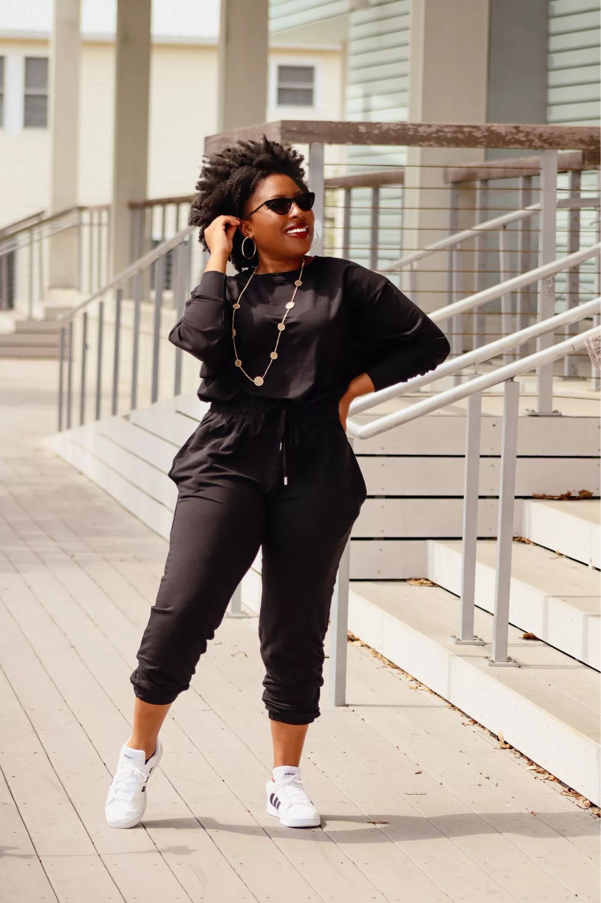 Plus size outfit ideas. Black jumpsuit. Louis Vuitton.