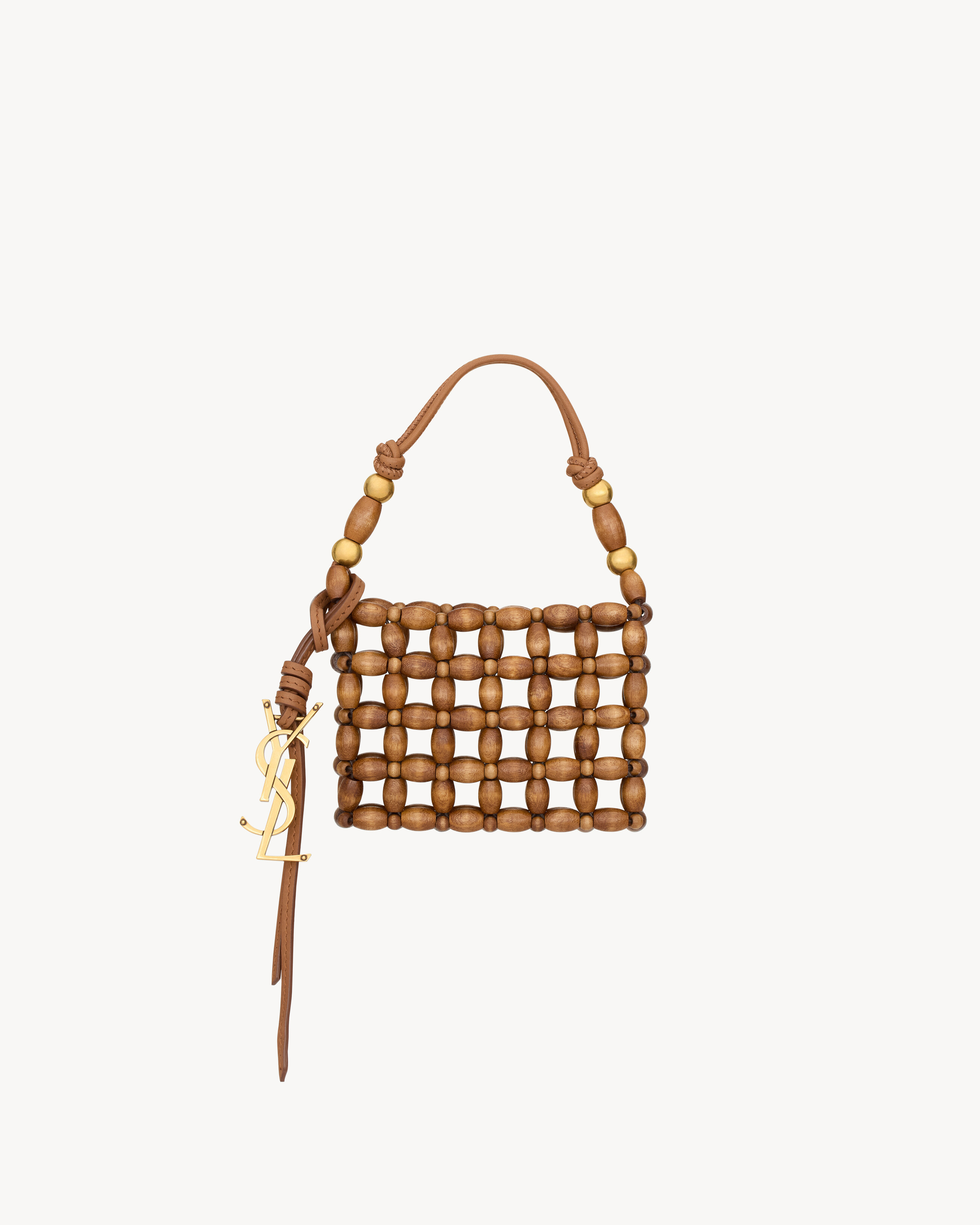 Minaudière in wood beads, decorated with a CASSANDRE tassel charm. This sophisticated and femini... | Saint Laurent Inc. (Global)