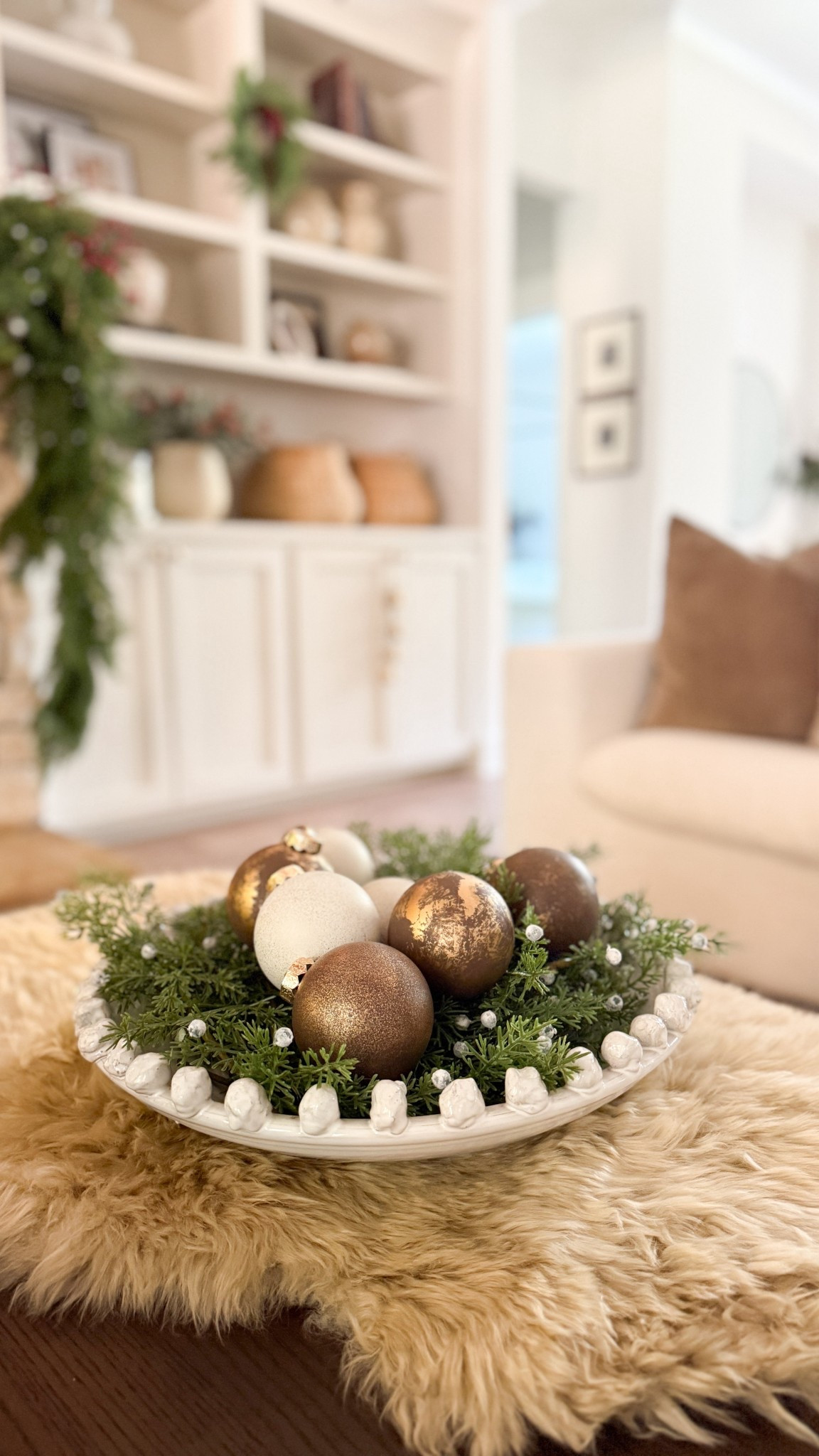 I did a similar version of this last year and decided to replicate it with my favorite Wayfair bowl! 🥰 I placed these cedar picks from Amazon inside and added some textured ornaments. I love how the sheep skin adds a bit more cozy! 

#LTKHoliday #LTKSeasonal #LTKHome