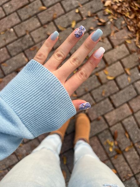New Spring nails! Baby blue nail polish, cream white nail polish,  and floral nail design (press on nails). Also, obsessed with these Ugg dupes!! These ugg mini booties are super comfy and the platform is so chic. Under $60. Xoxo

#LTKshoecrush #LTKSpringSale #LTKfindsunder100