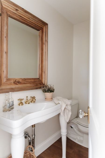 Shop our entryway bathroom from our latest reel! Post includes sink, brass faucet, terracotta pot, and brass and crystal door knob. Bathroom inspiration, powder room, powder room decor, powder room brass hardware, powder room sink, white sink, bathroom decor, home decor.

#LTKstyletip #LTKhome
