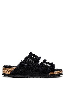 BIRKENSTOCK Arizona Shearling Sandal in Black from Revolve.com | Revolve Clothing (Global)