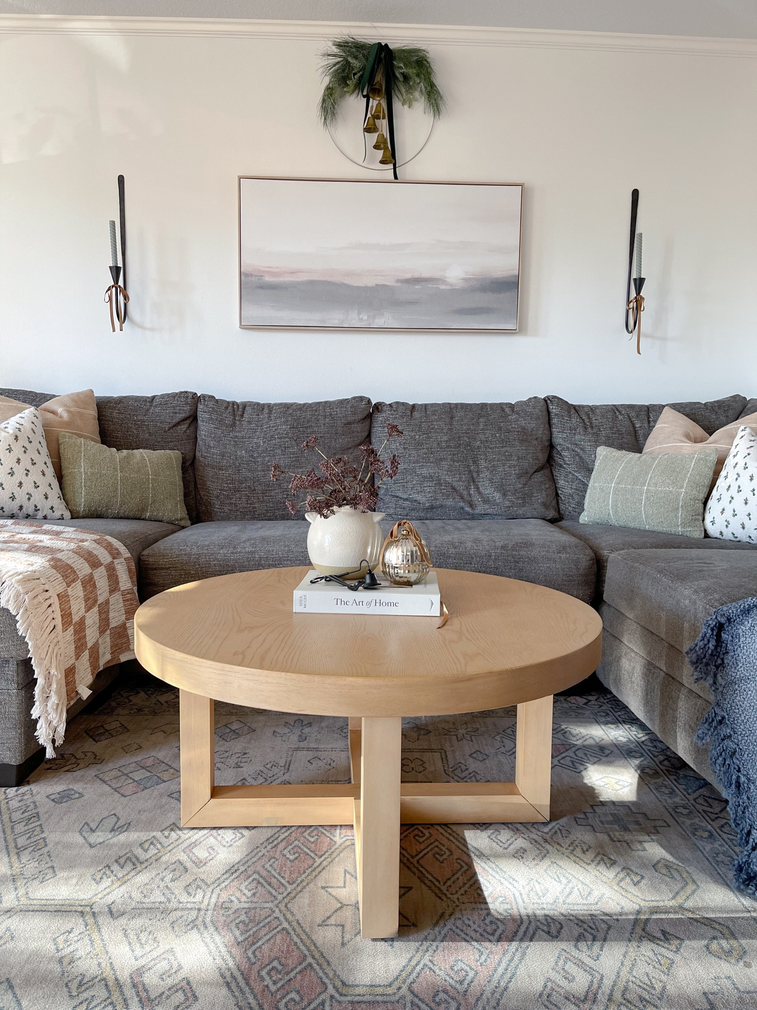 Coffee table Christmas decor. Living room decor. Throw blanket. Throw pillow Christmas. Candle sconces. Christmas wreath. Gold bells. Ornament candle. Gray sectional. Washable rug. Christmas home decor 

#LTKhome #LTKHoliday #LTKstyletip