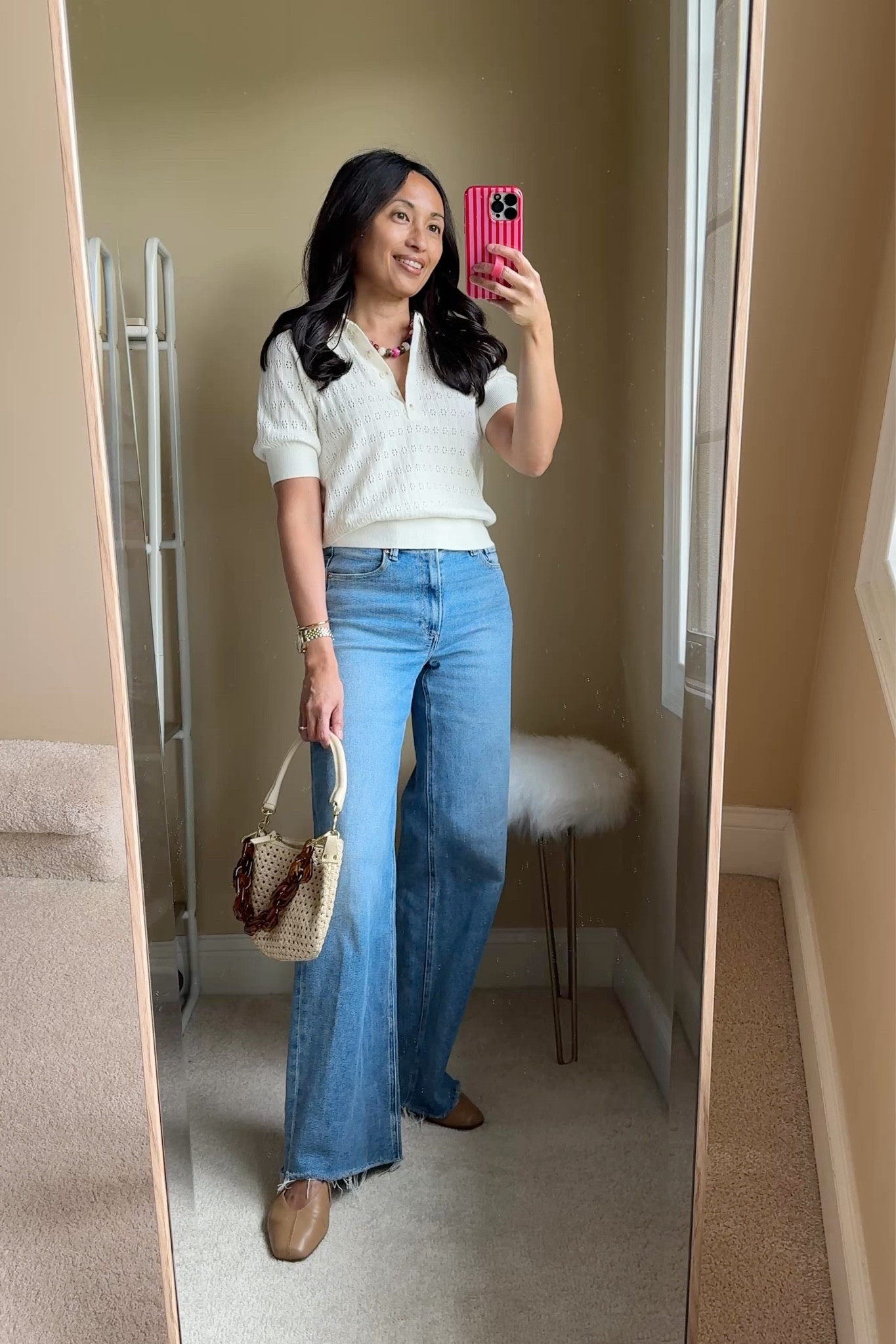 Elevated casual spring outfit: sweater & jeans. 
- Lots of still cool days ahead. Spring weight sweaters and jeans for easy outfits.  Elevate with accessories and shoes. 
If you are shopping:
- This is a short sleeve sleeve version of my favorite spring sweaters. I have a few of the long sleeve sweaters in various styles from over the years. This exact sweater is currently on sale for around $20. Could be dressed up for the office  True to size. 
- Jeans are premium and would be worth the splurge for you if you like a classic wide leg with stretch for comfort. True to size. 
- Necklace is a good look for less option; around $15. Multiple colors available. I have a nice stone necklace that I have worn for years and wanted a different color, but didn’t want to invest. 
- Bracelet is a new style from one of my favorites for good quality timeless everyday bracelets. 
- Ballet flats are an investment and would be worth it for you if you wear flats often and have trouble finding the right fit. True to size. 
- Woven handbag is another older piece that I use for spring, summer, and vacations. 
- Lipgloss is a good clean beauty choice with a nice color range. 


#LTKOver40