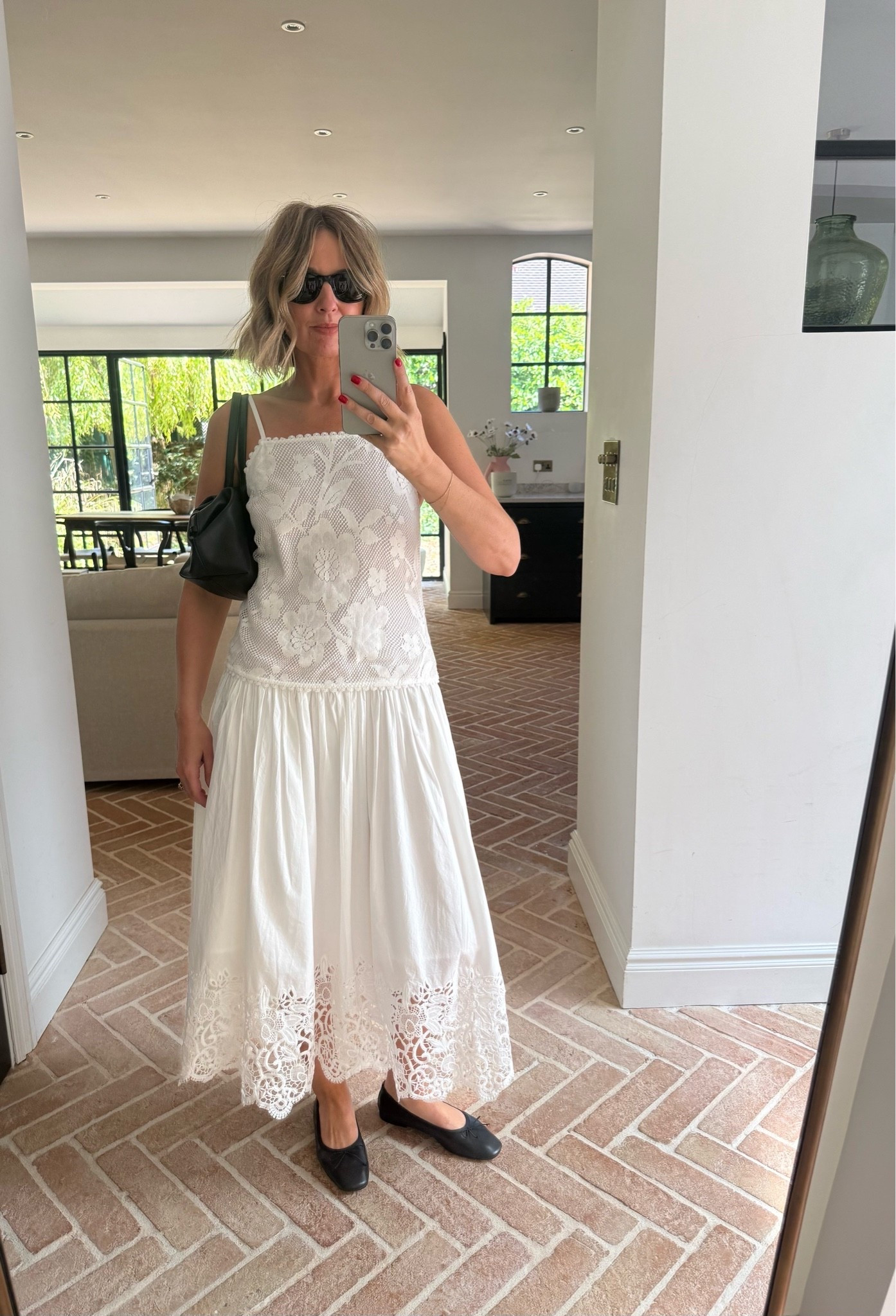 white lace maxi dress, floral lace dress, crochet lace dress, spaghetti strap dress, drop waist dress, tiered maxi dress, broderie lace hem, white summer dress, cottagecore dress, romantic feminine style, black ballet flats, black shoulder bag, black cat eye sunglasses, gold bracelet, mirror selfie ootd, effortless summer style, elevated basics, quiet luxury, bridal white, resort wear, vacation outfit, ltkstyletip, ltkseasonal, ltksummer, ltkfindsunder100, ltkbeauty, ltkitbag

#LTKsummer #LTKeurope #LTKdresses