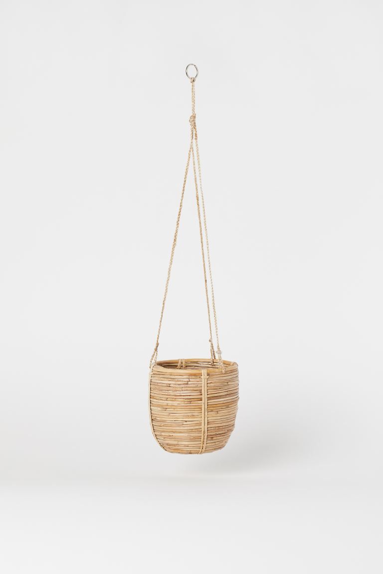 Hanging basket in braided rattan with three cords and a metal ring at top. Diameter 6 1/4 in., he... | H&M (US + CA)