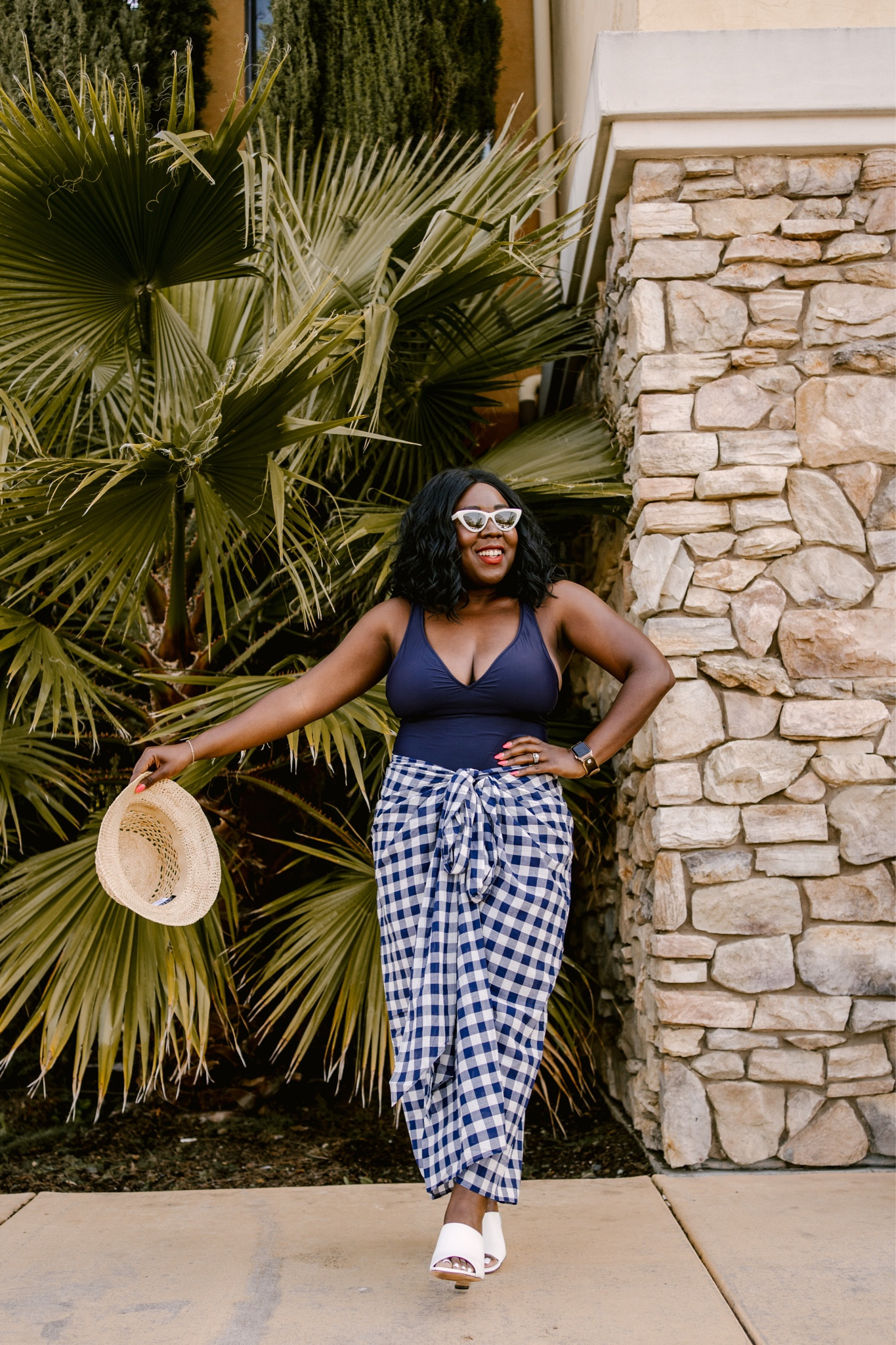 Beach ready!! I feel so classy in this look from J.Crew! Navy one piece with a gingham cover up, woven straw hat, white sunglasses and white wedge heels!

#LTKstyletip #LTKshoecrush #LTKswim