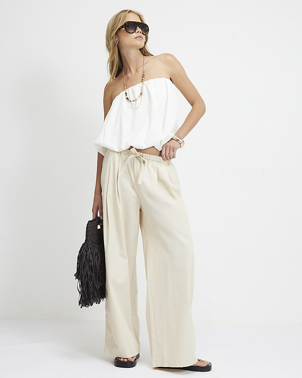 Cream Mid Rise Tie Waist Wide Leg Trousers | River Island UK & IE